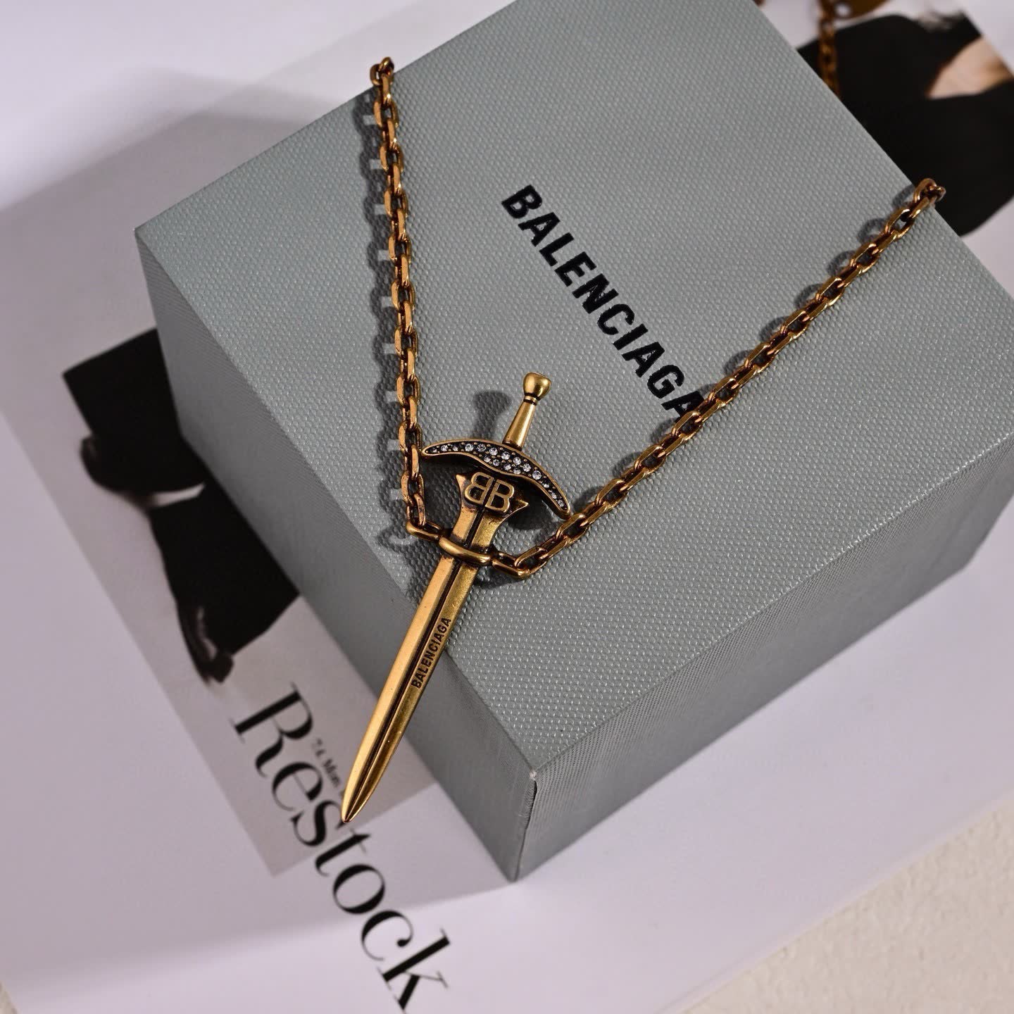 Balenciaga Sword Earrings with Red Gemstone