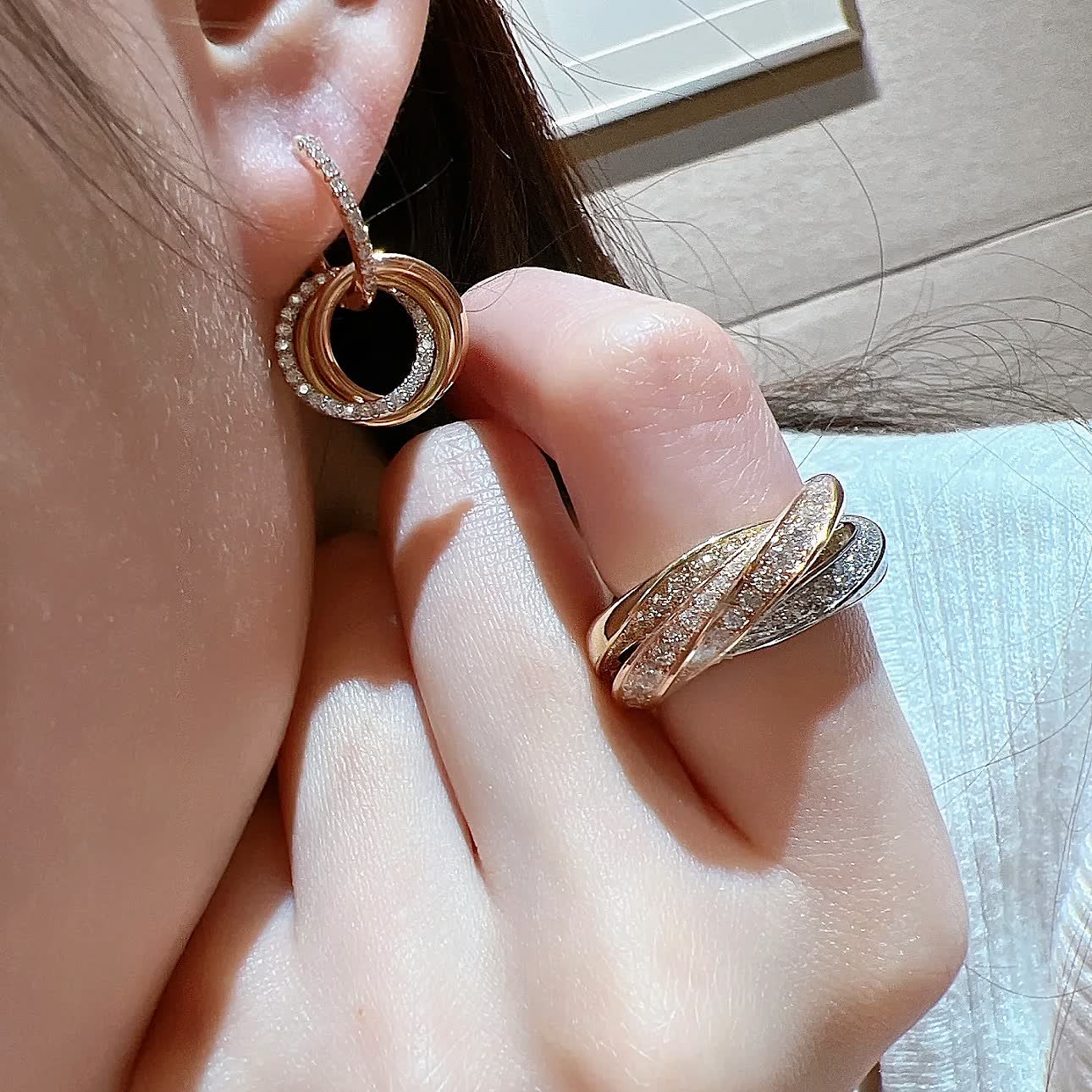 Cartier Elegant Gold and Diamond Hoop Earrings