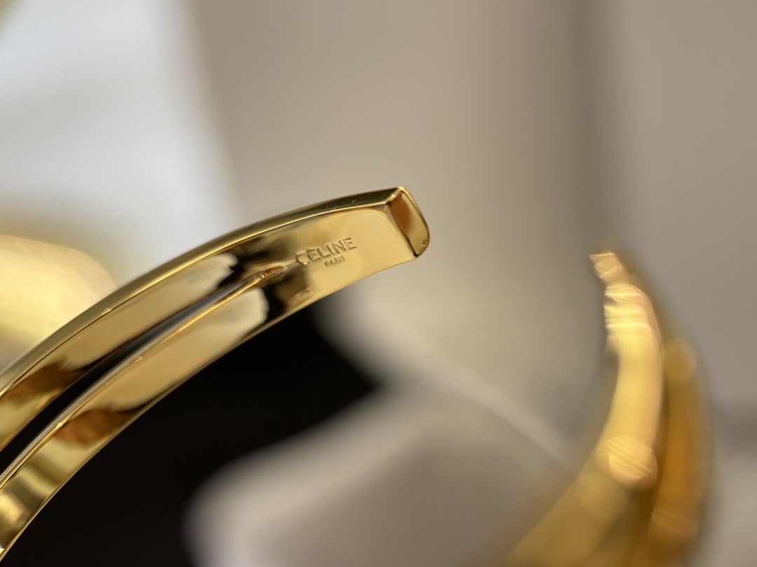 Celine Gold Tone Engraved Bracelet