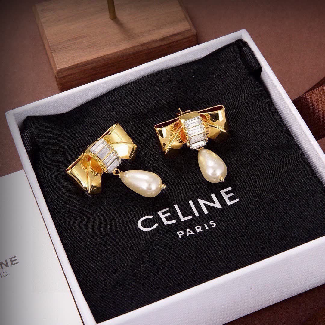 Celine Paris Gold Tone Pearl and Crystal Bow Earrings