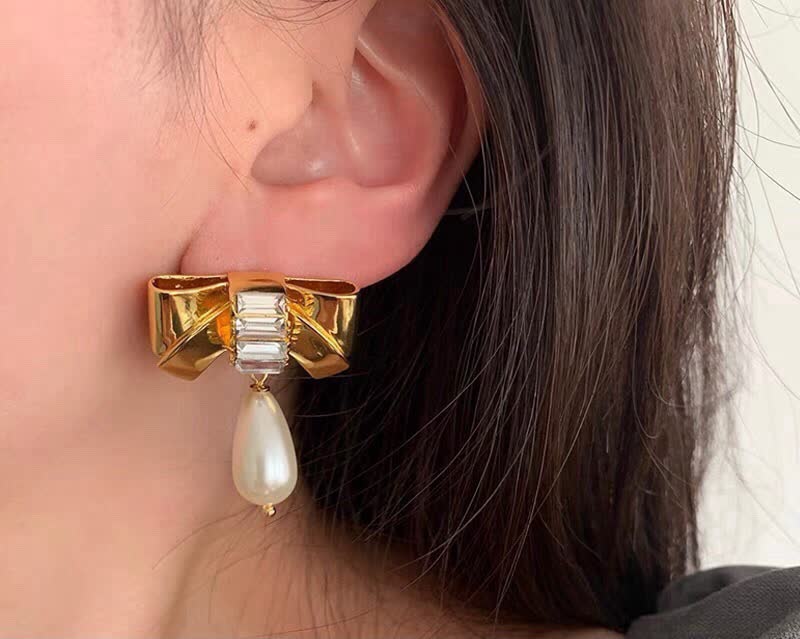 Celine Paris Gold Tone Pearl and Crystal Bow Earrings
