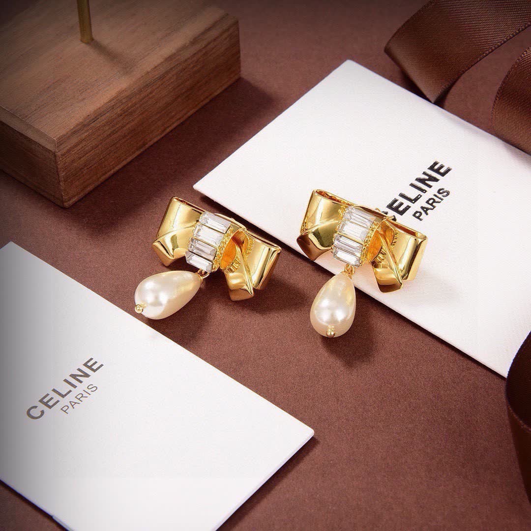 Celine Paris Gold Tone Pearl and Crystal Bow Earrings