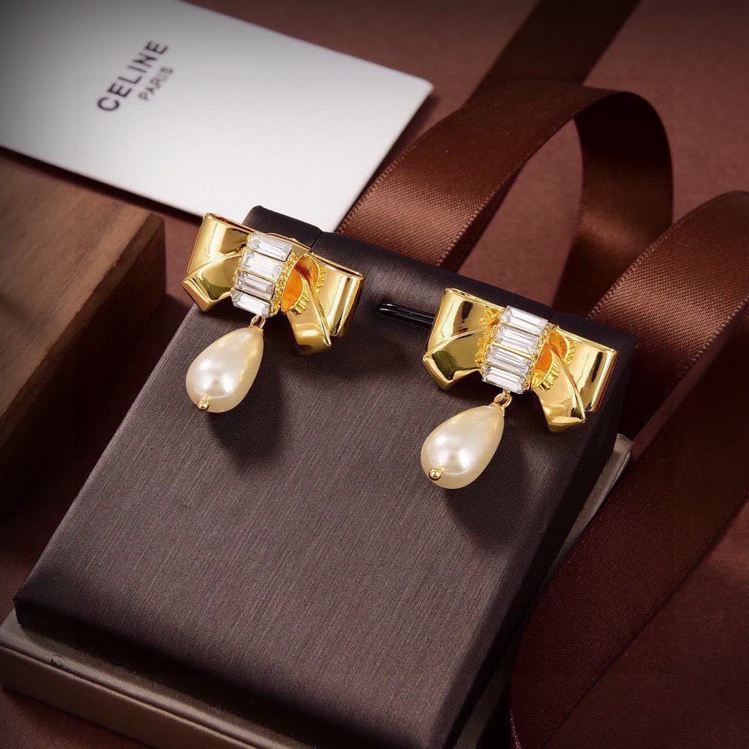 Celine Paris Gold Tone Pearl and Crystal Bow Earrings