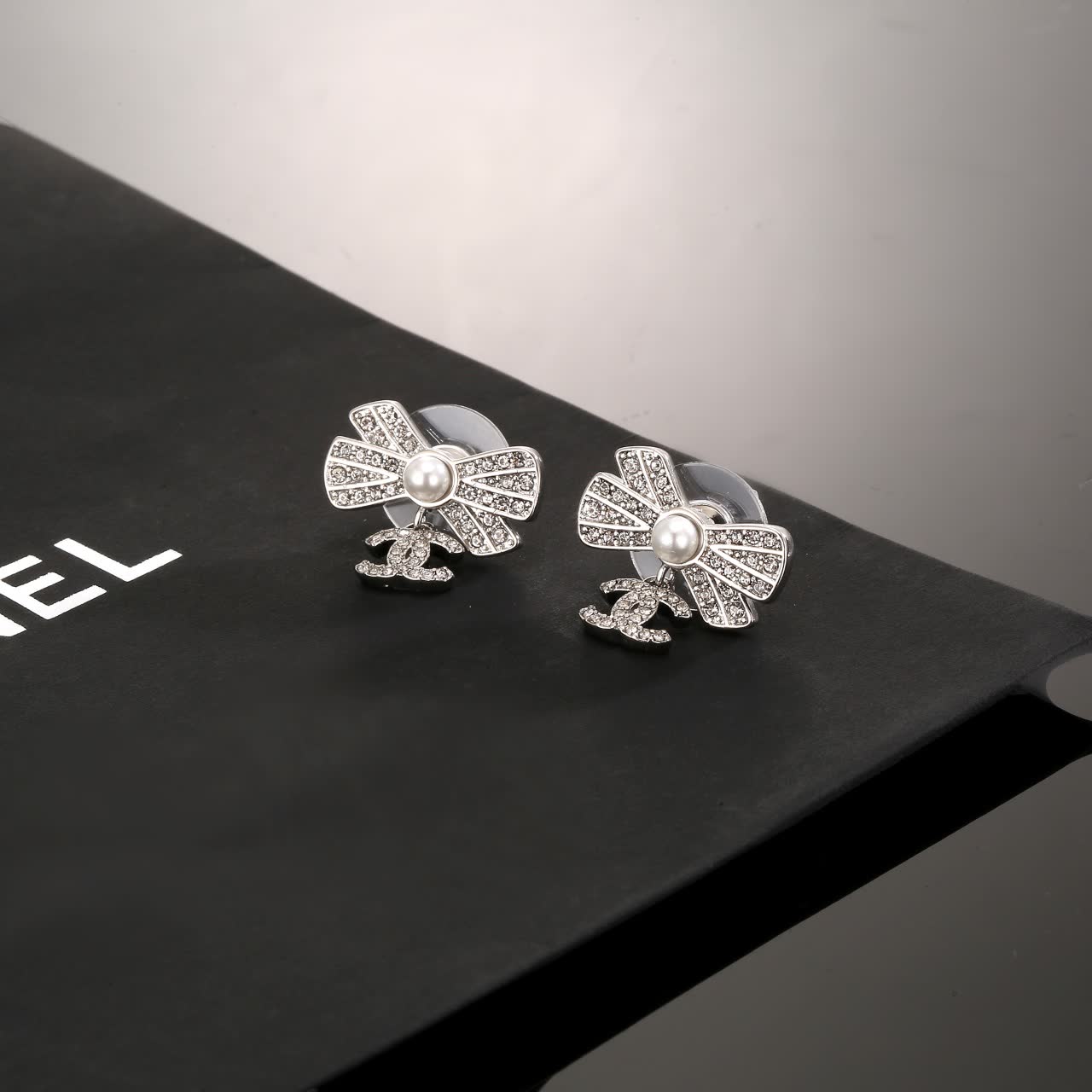 Chanel Silver Bow Earrings with Pearls and CC Logo