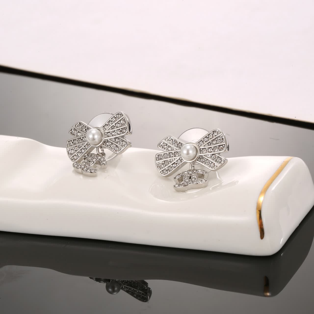 Chanel Silver Bow Earrings with Pearls and CC Logo
