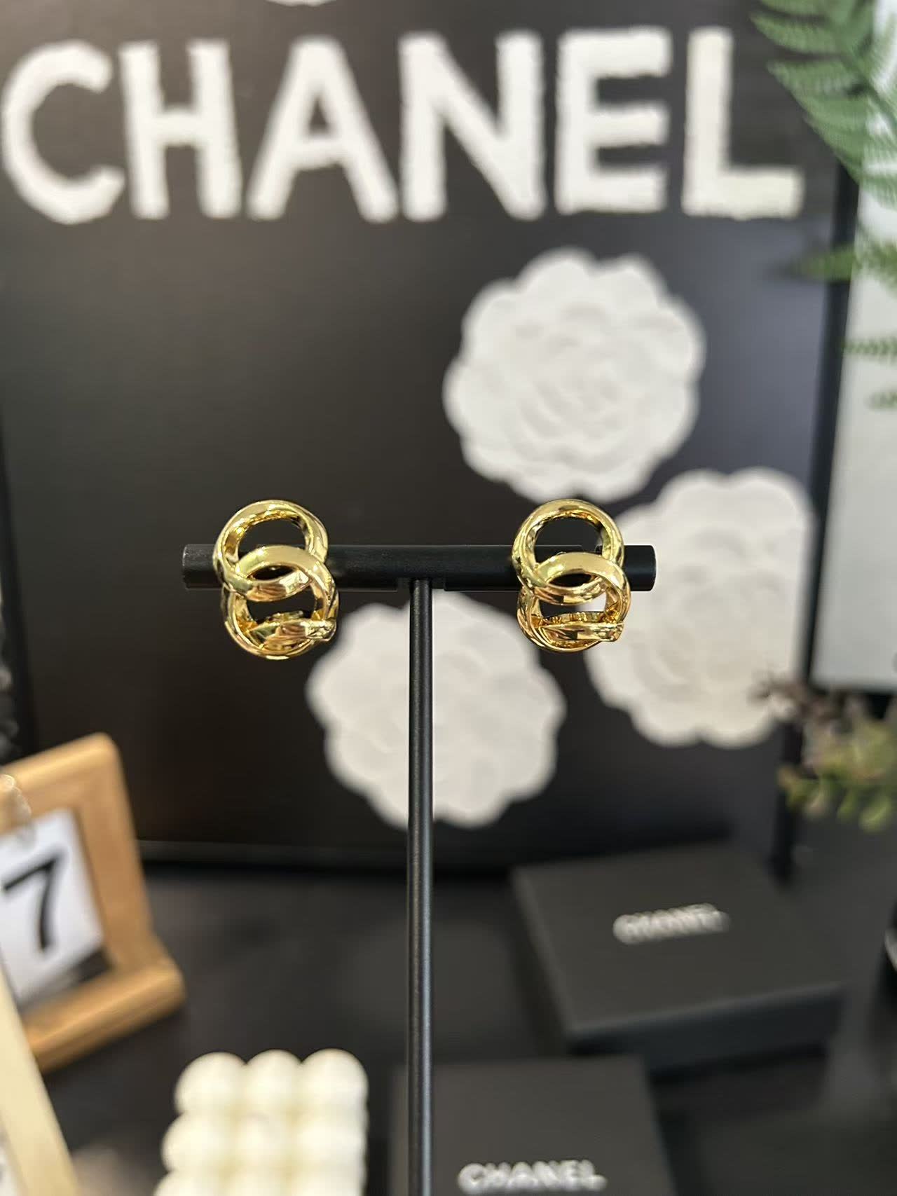 Chanel Gold Tone Interlocking Ring Earrings