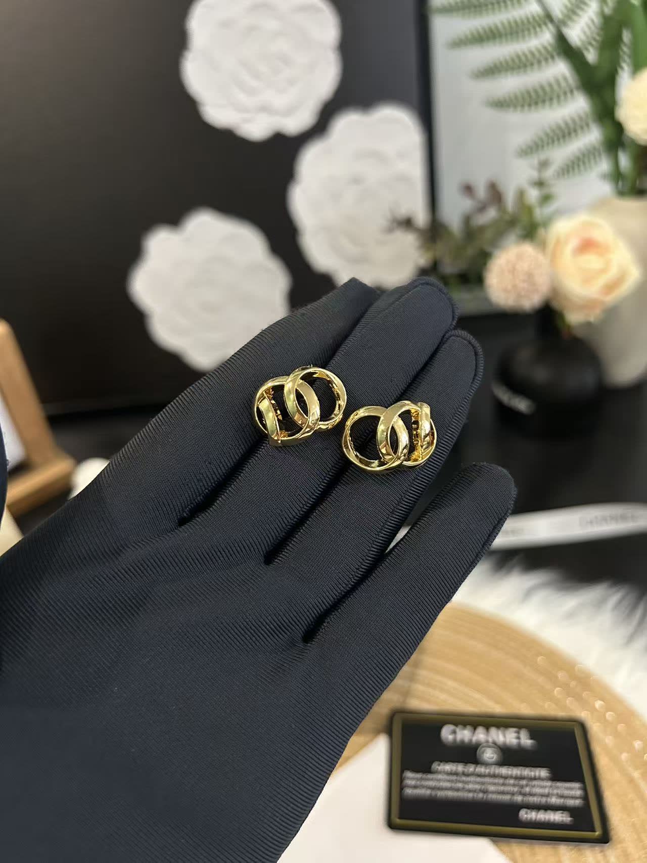 Chanel Gold Tone Interlocking Ring Earrings