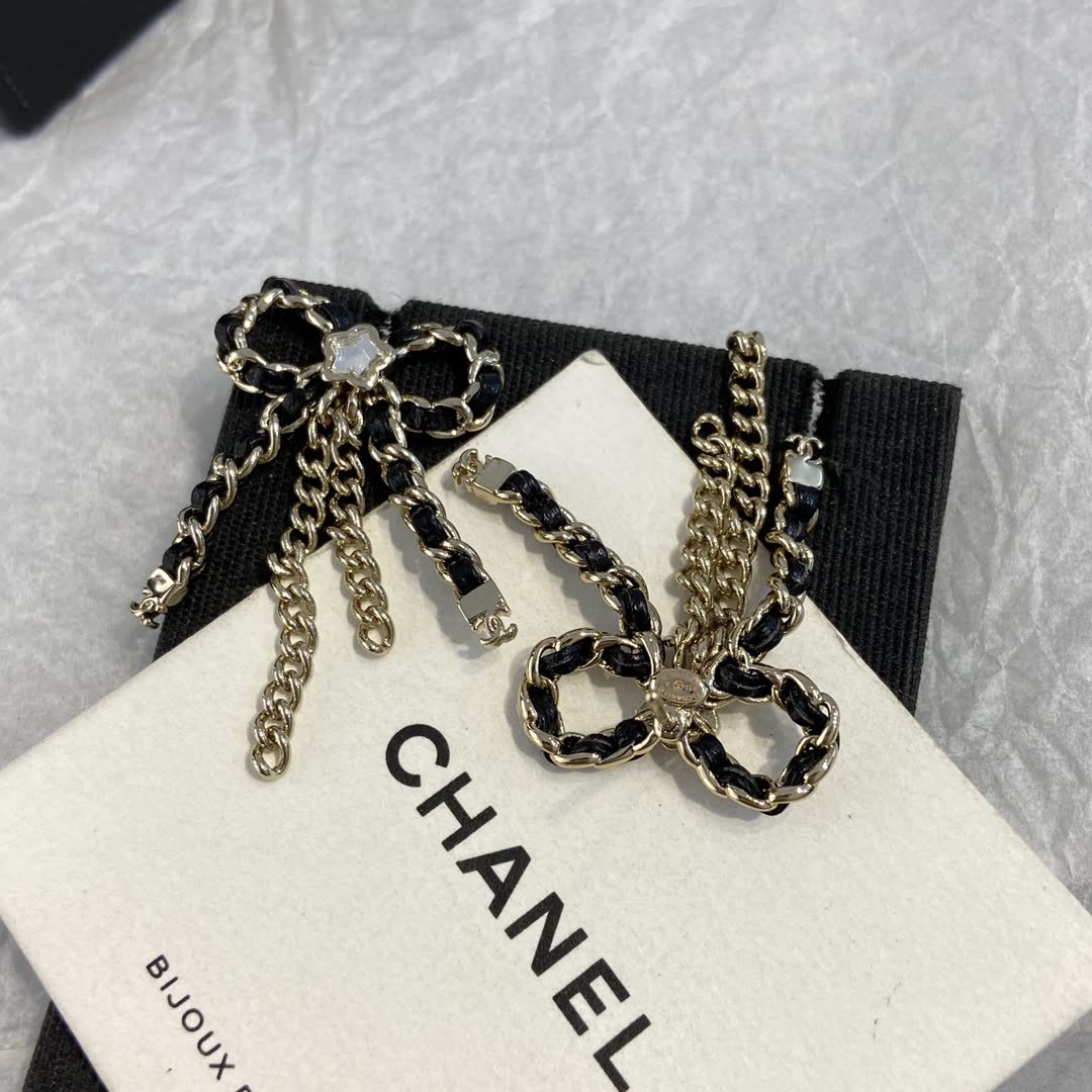 Chanel Black and Gold Chain Bow Earrings