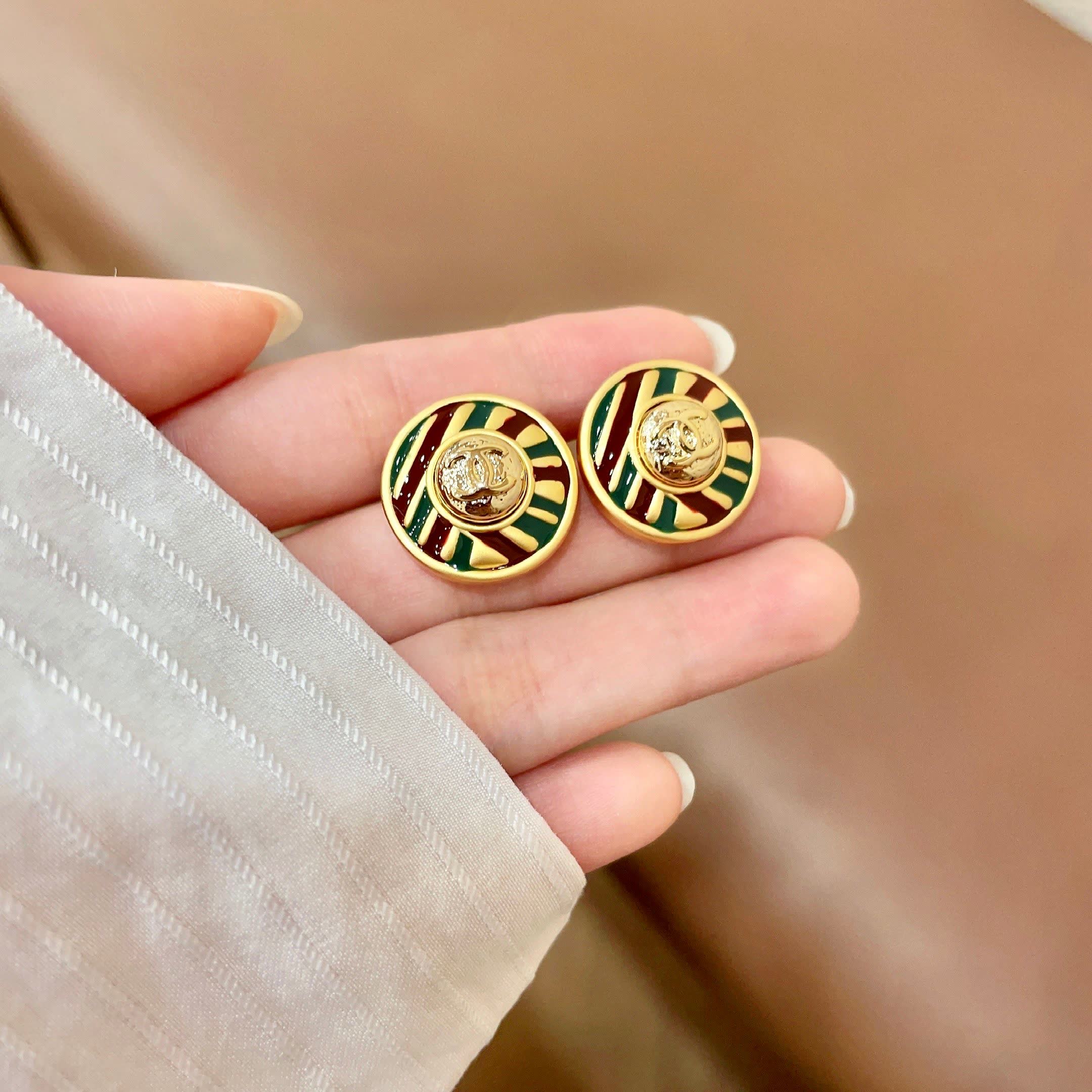 Chanel Gold Tone Striped Stud Earrings