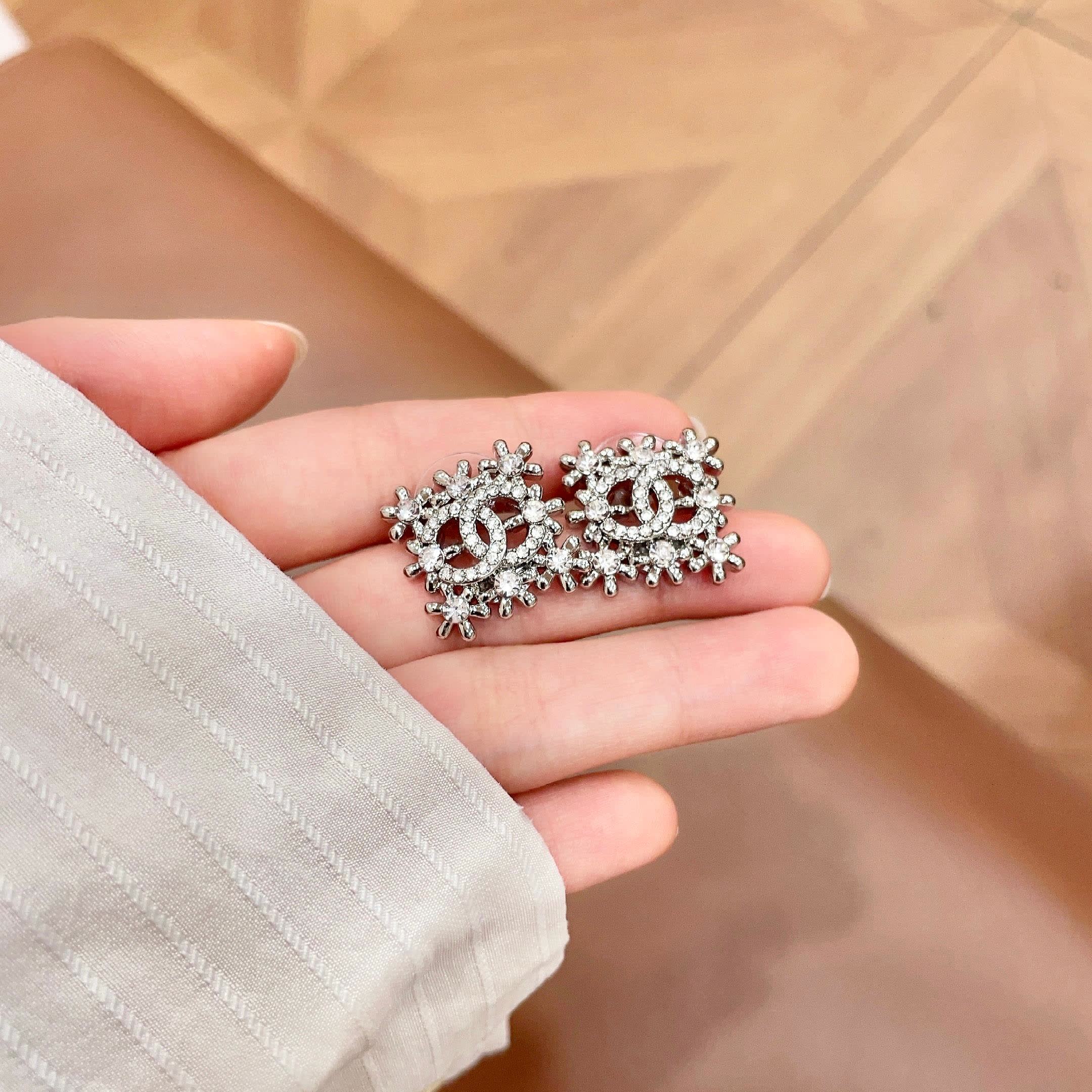 Chanel CC Logo Snowflake Stud Earrings