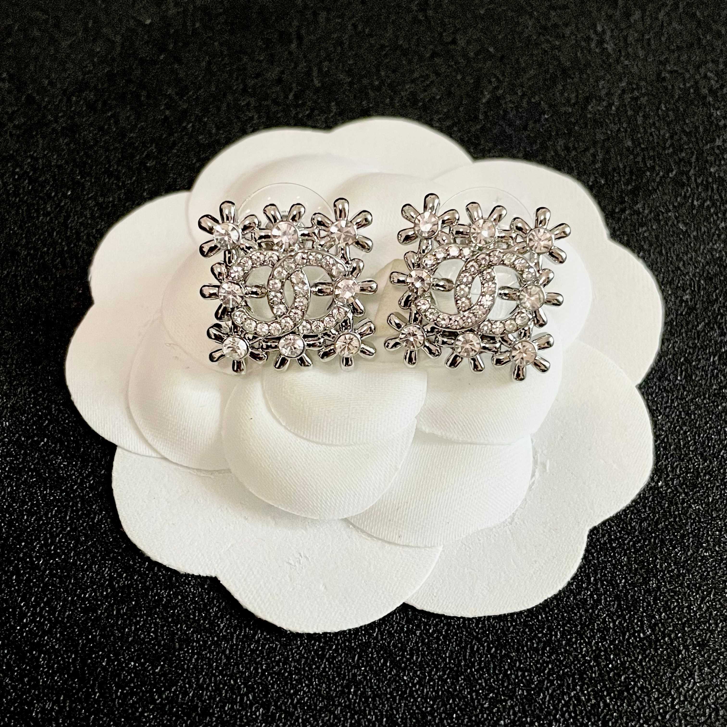 Chanel CC Logo Snowflake Stud Earrings