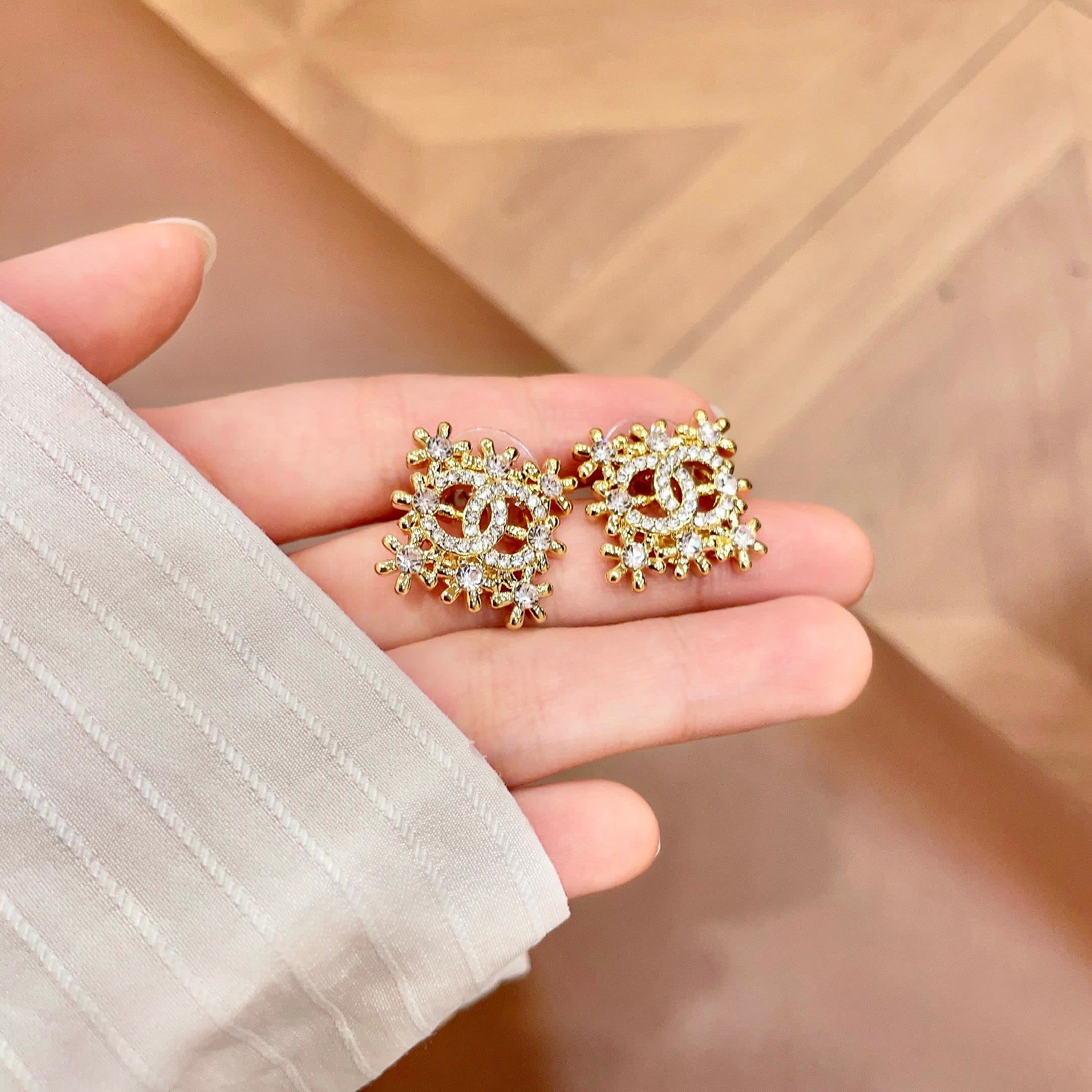 Chanel CC Logo Snowflake Earrings