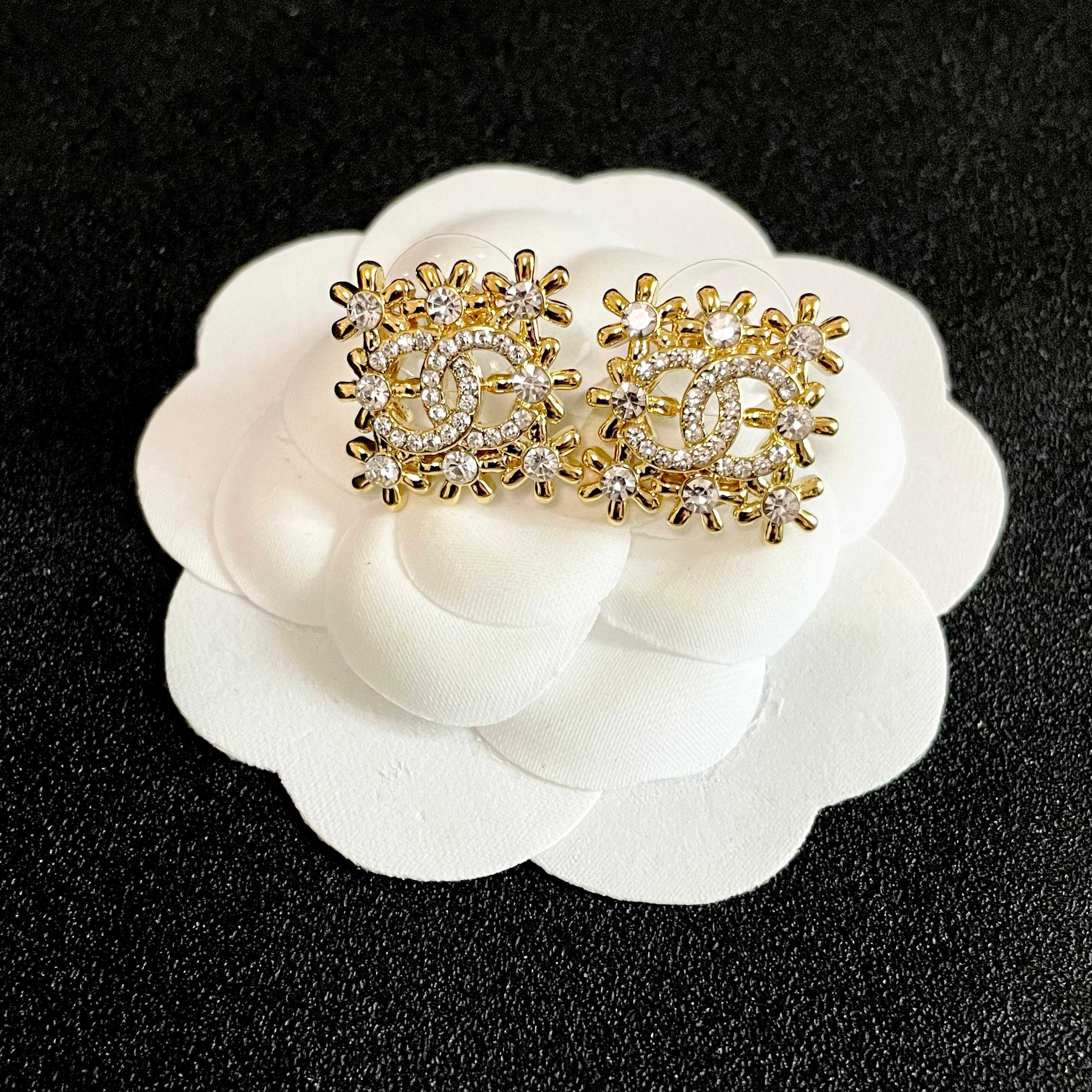 Chanel CC Logo Snowflake Earrings