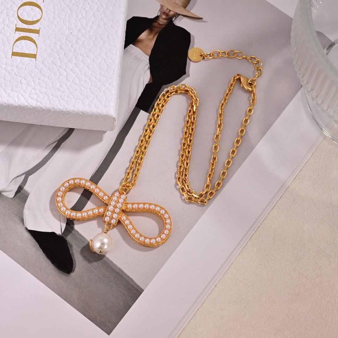 Dior Gold Tone Pearl Bow Earrings Dior Gold Tone Pearl Bow Earrings