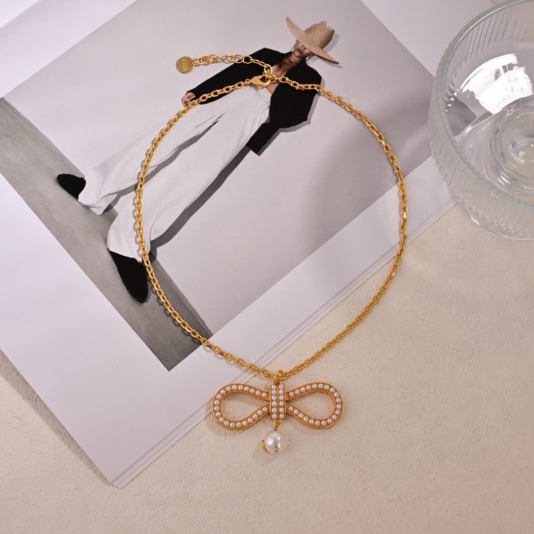Dior Gold Tone Pearl Bow Earrings