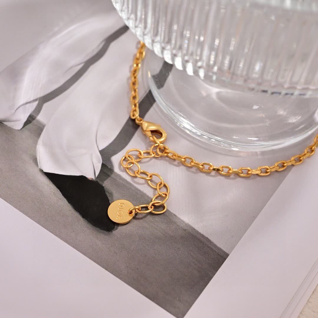 Dior Gold Tone Pearl Bow Earrings