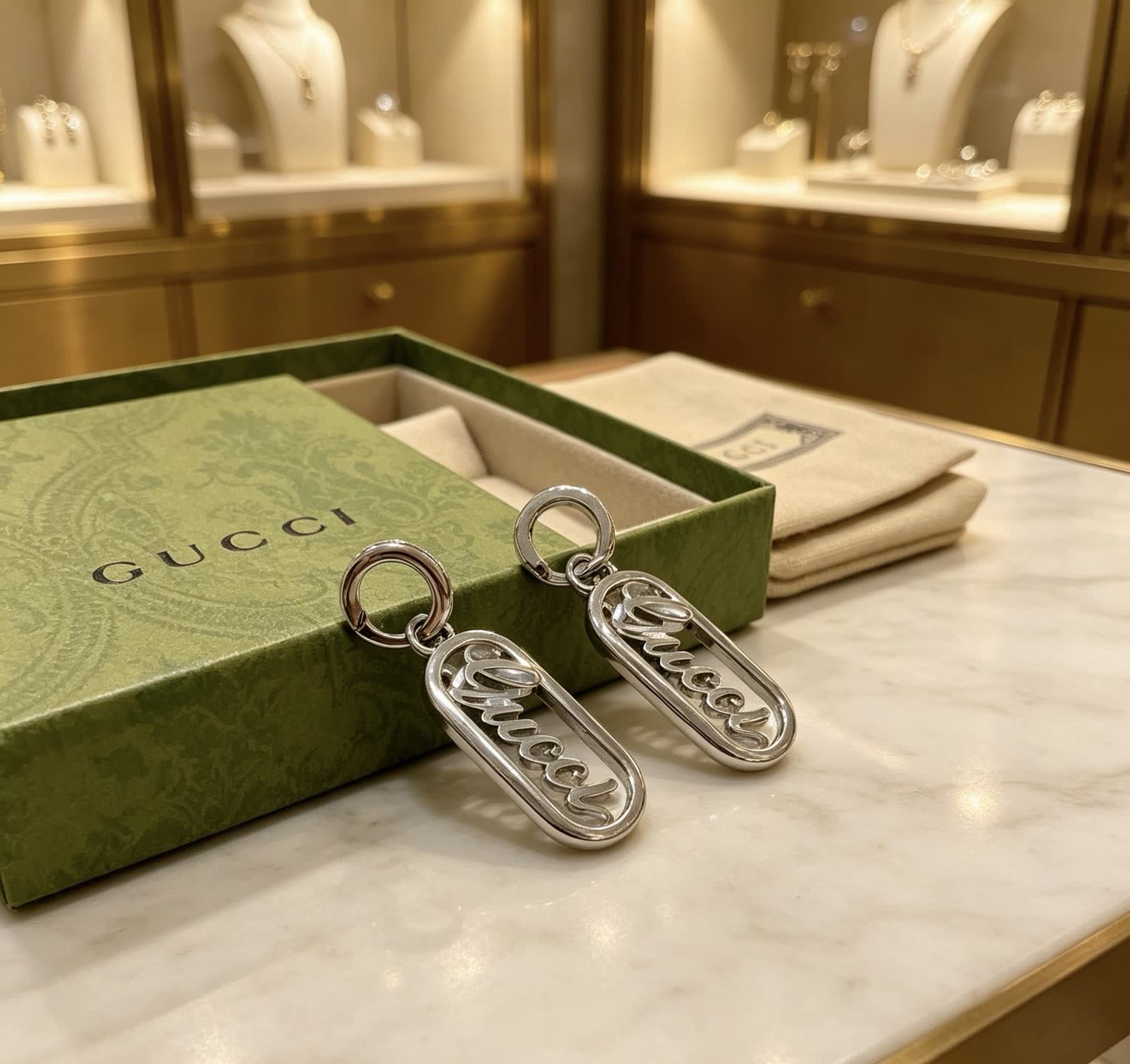Gucci Silver Logo Earrings