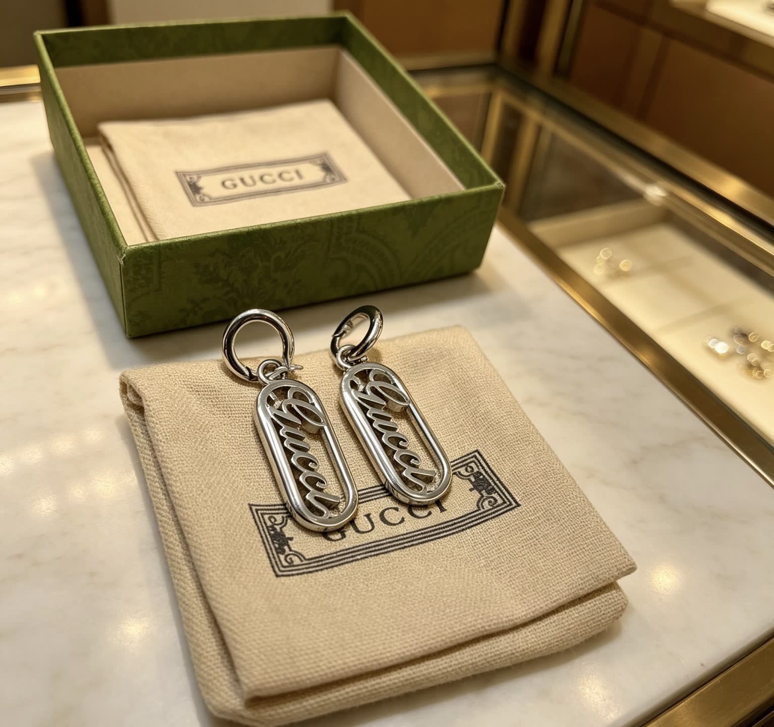 Gucci Silver Logo Earrings