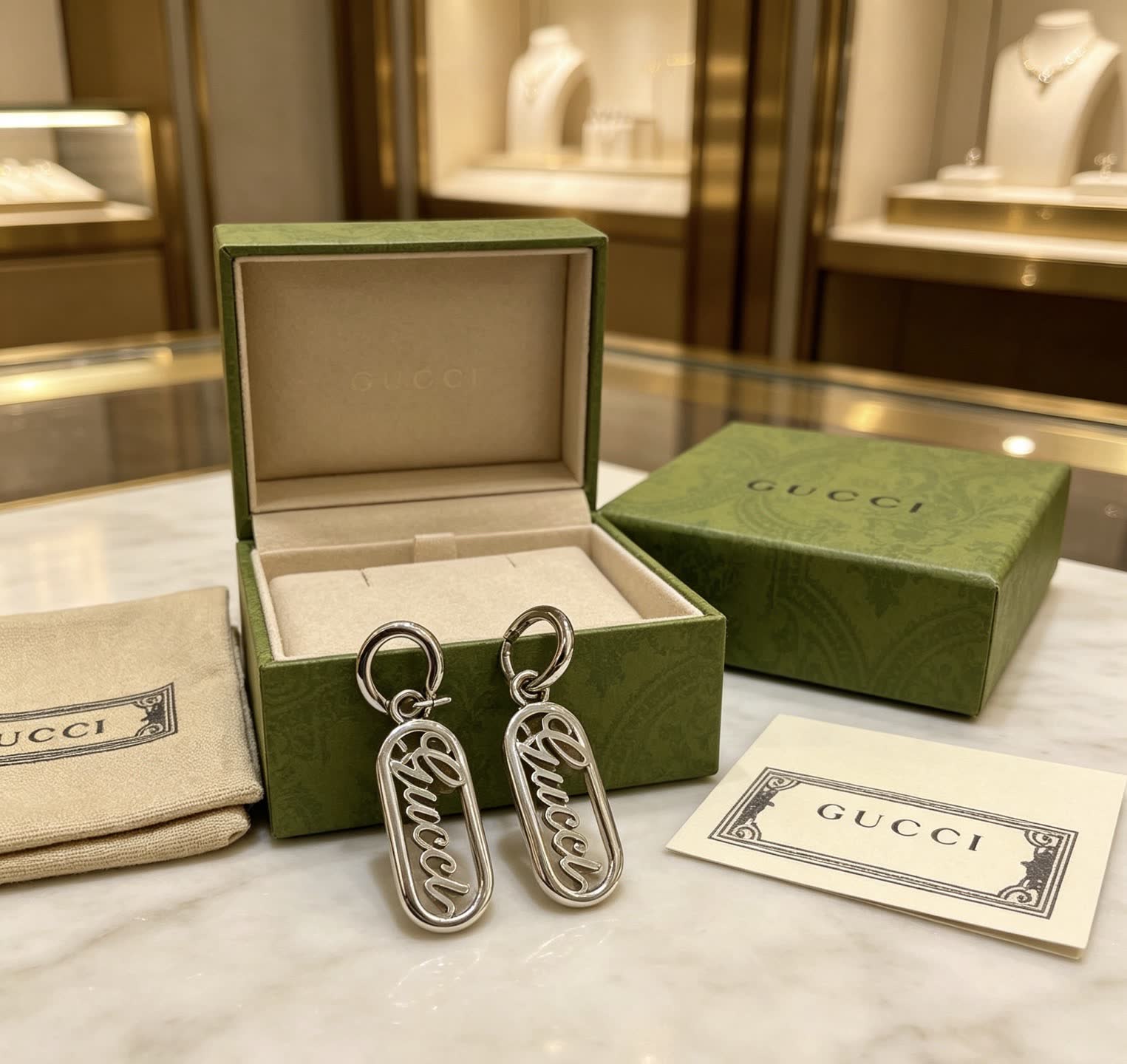Gucci Silver Logo Earrings