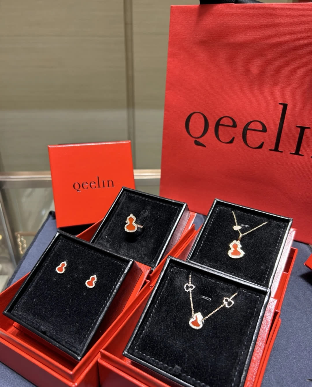 Qeelin Gold Buddha Stud Earrings with Red Enamel