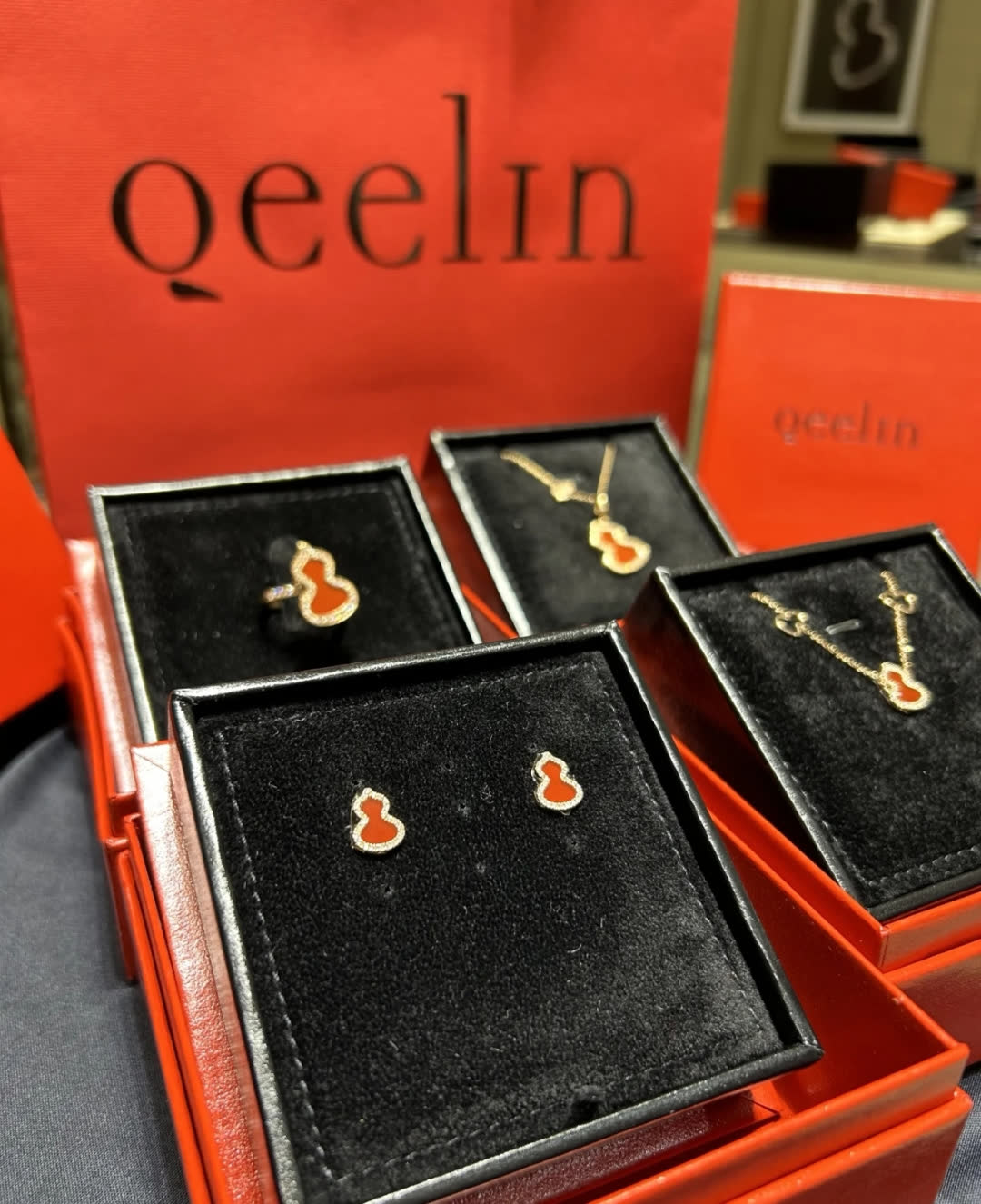 Qeelin Gold Buddha Stud Earrings with Red Enamel