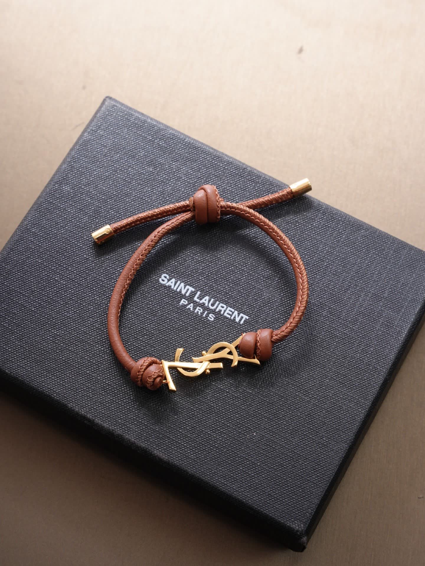 Saint Laurent Leather Bracelet with Gold Logo