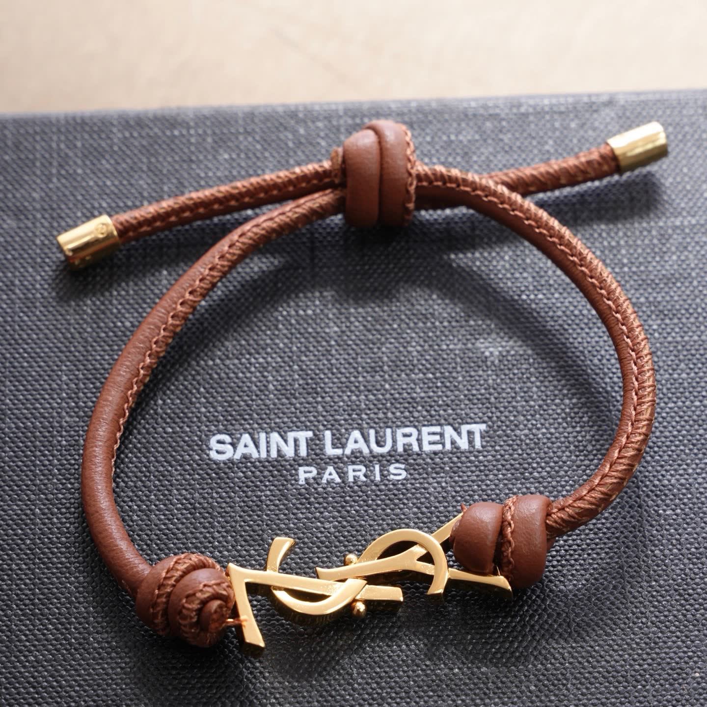 Saint Laurent Leather Bracelet with Gold Logo