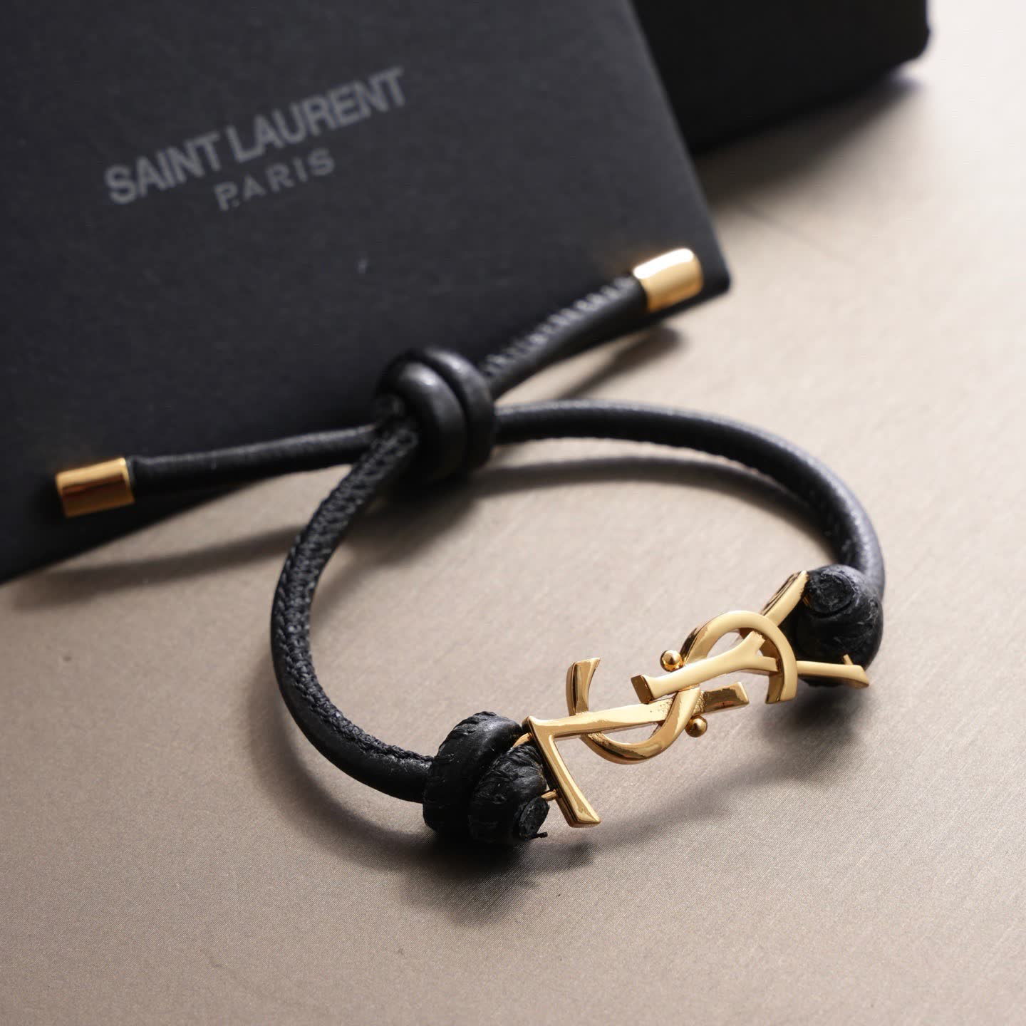Saint Laurent Leather Bracelet with Gold Logo