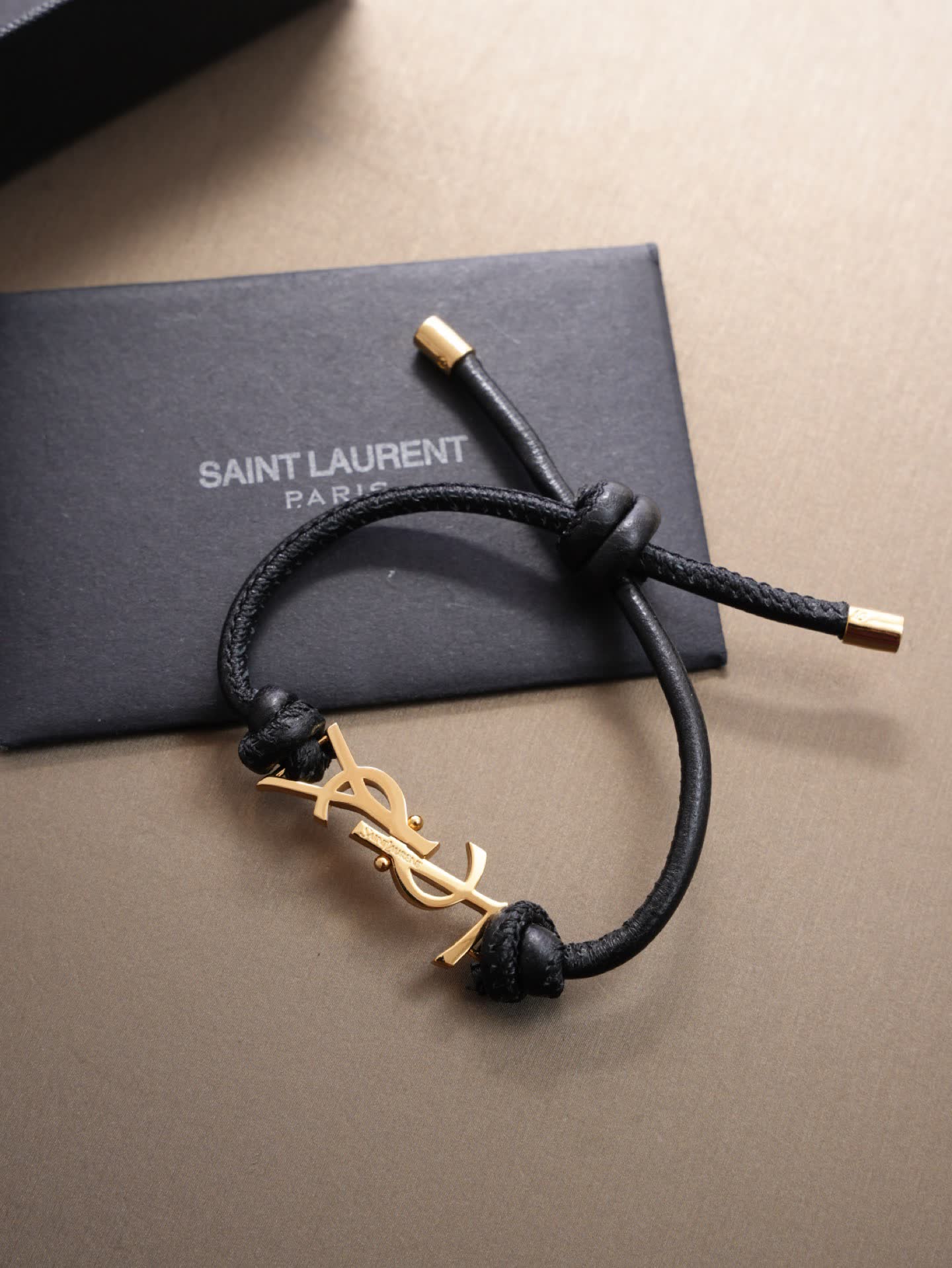 Saint Laurent Leather Bracelet with Gold Logo