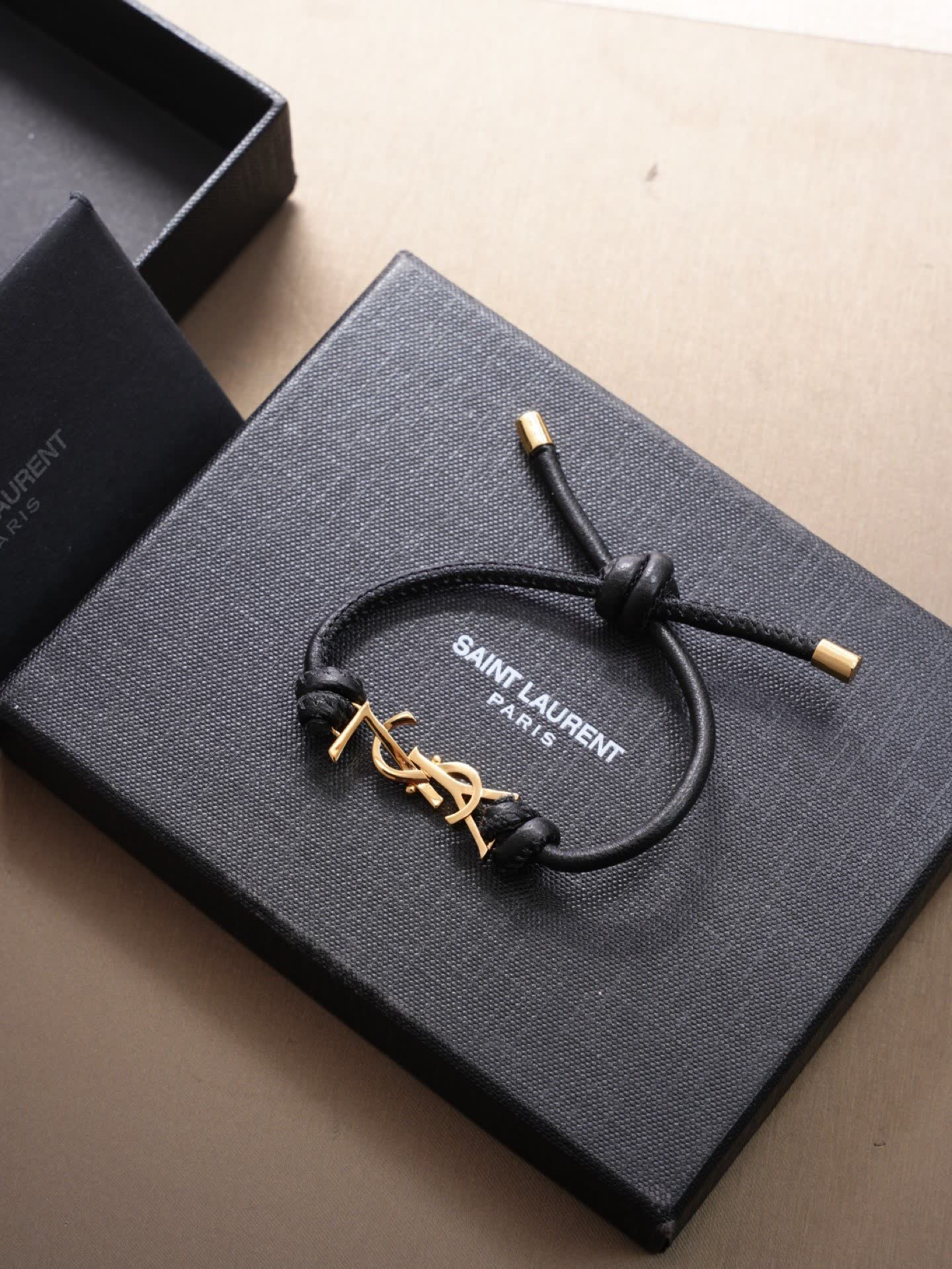 Saint Laurent Leather Bracelet with Gold Logo