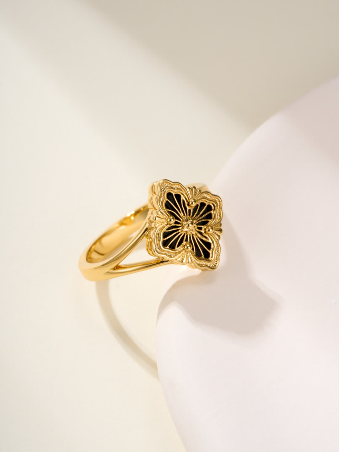 Buccellati Elegant Gold Ring with Black Enamel Flower Design