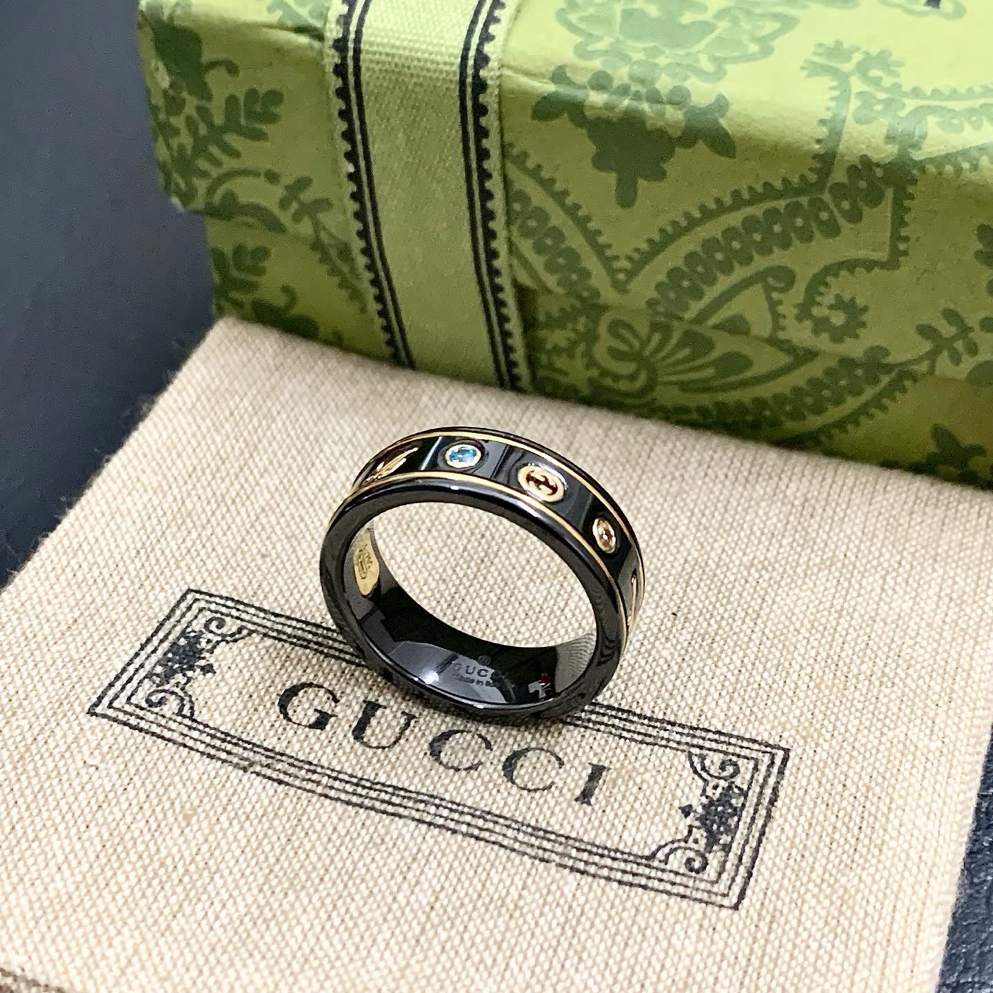 Gucci Black Ceramic Ring with Gold Accents and Gemstones