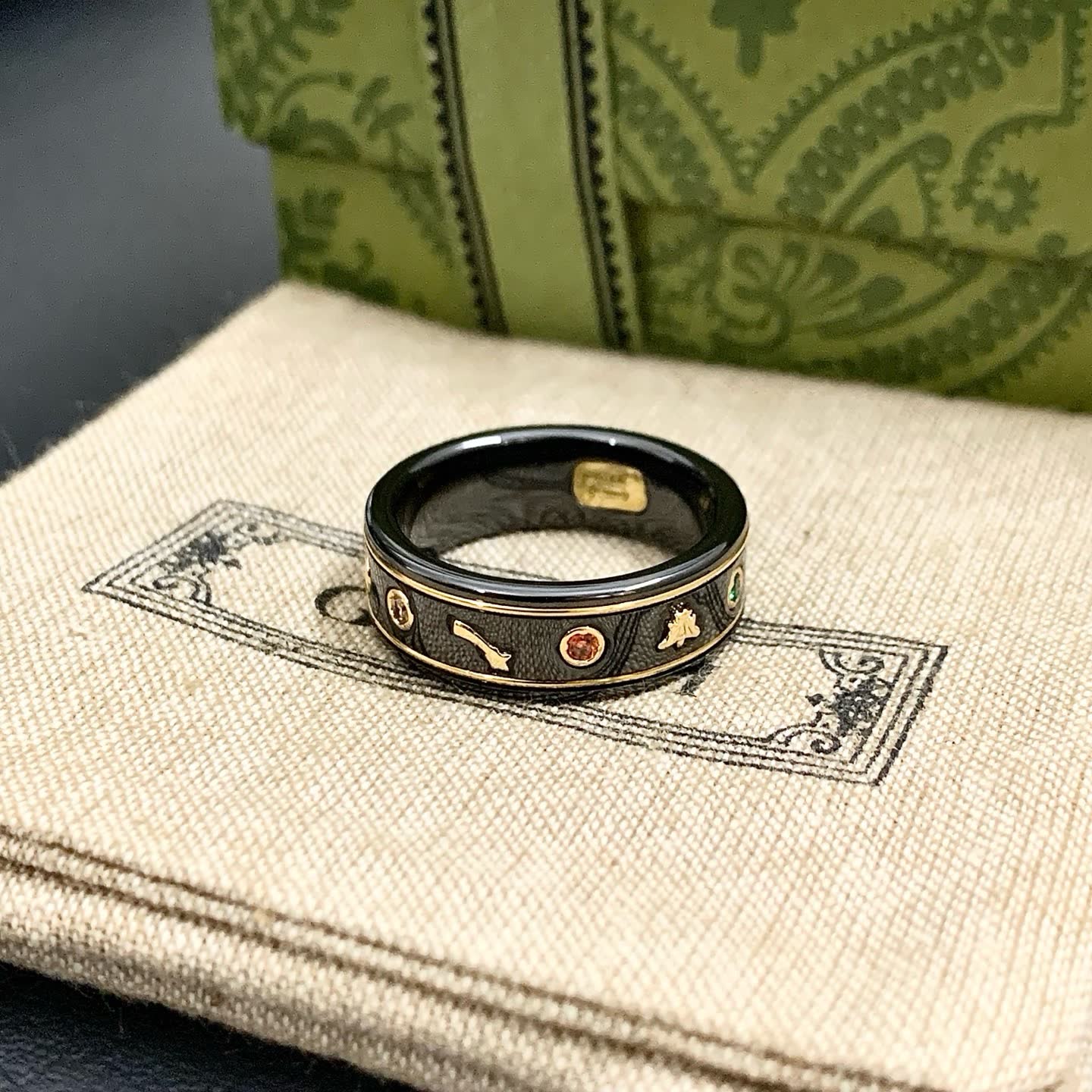 Gucci Black Ceramic Ring with Gold Accents and Gemstones