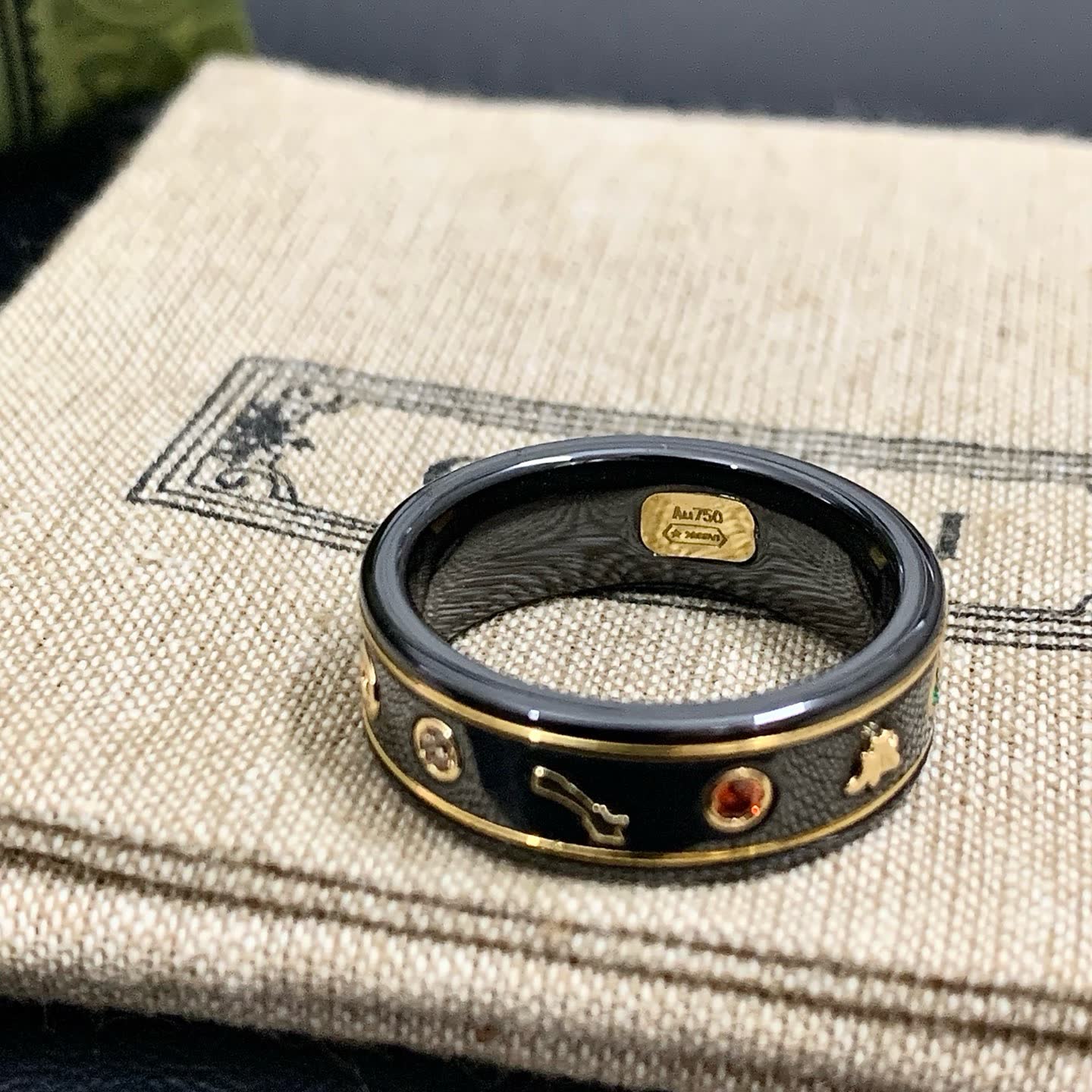 Gucci Black Ceramic Ring with Gold Accents and Gemstones
