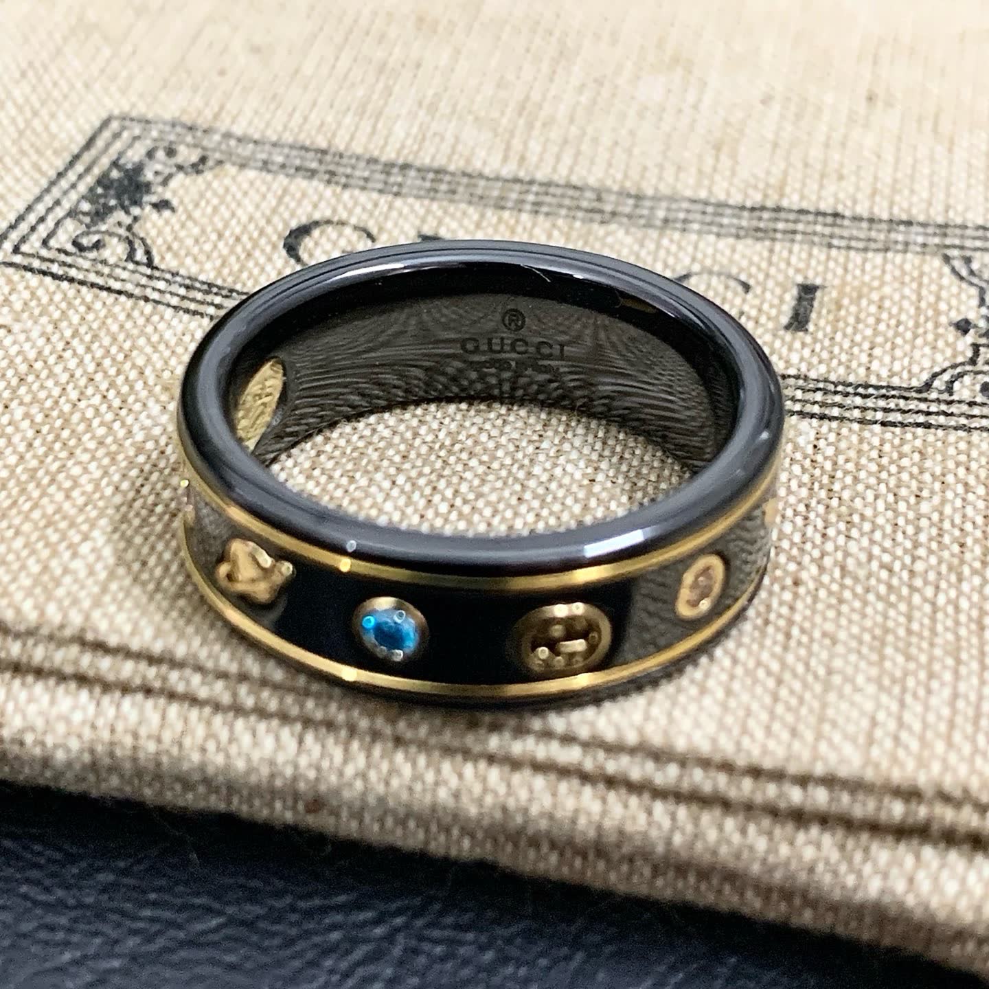 Gucci Black Ceramic Ring with Gold Accents and Gemstones