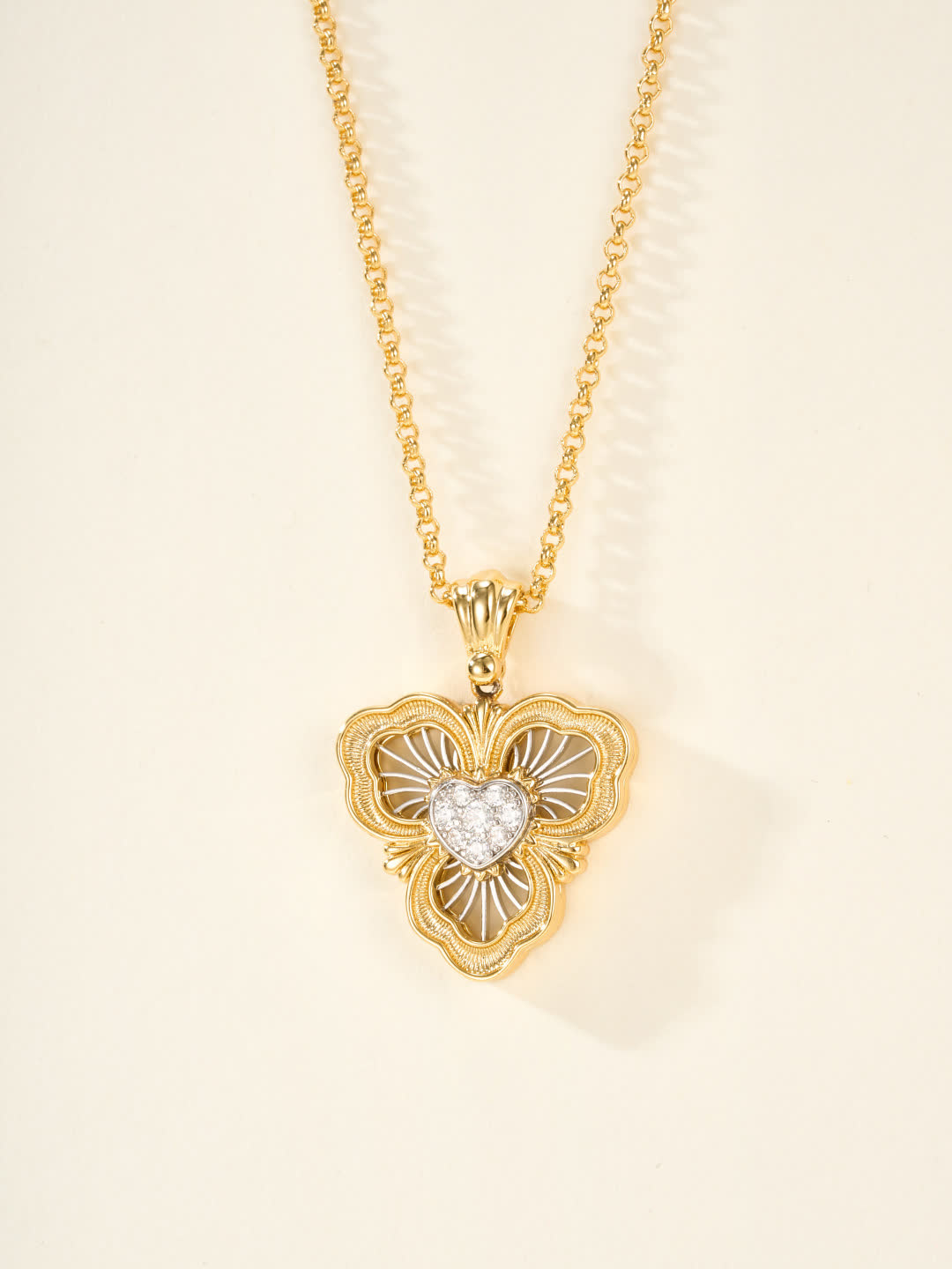 Buccellati Elegant Gold Heart Pendant with Diamond Accents