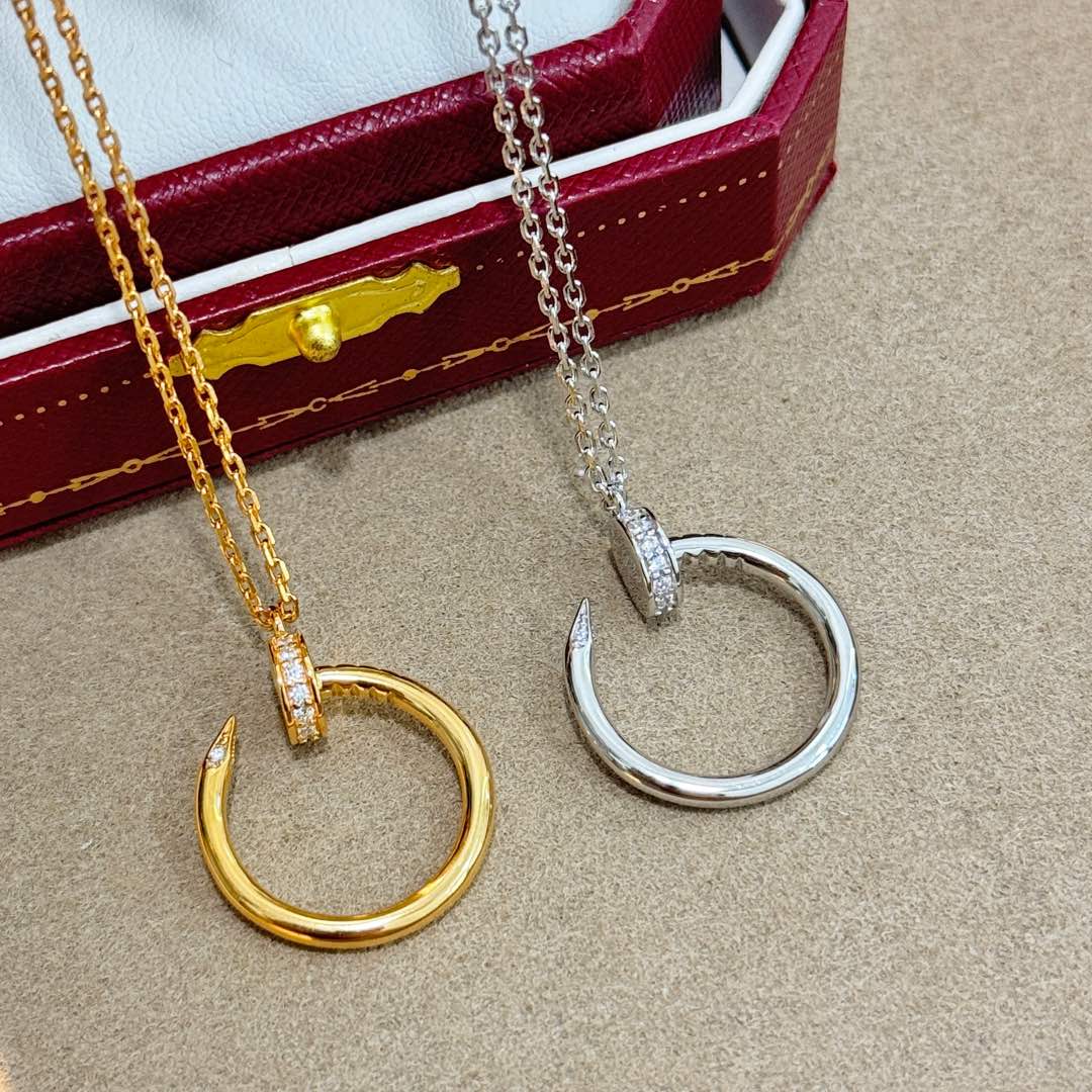 Elegant Gold and Silver Diamond-Encrusted Crescent Hoop Necklaces Elegant Gold and Silver Diamond-Encrusted Crescent Hoop Necklaces