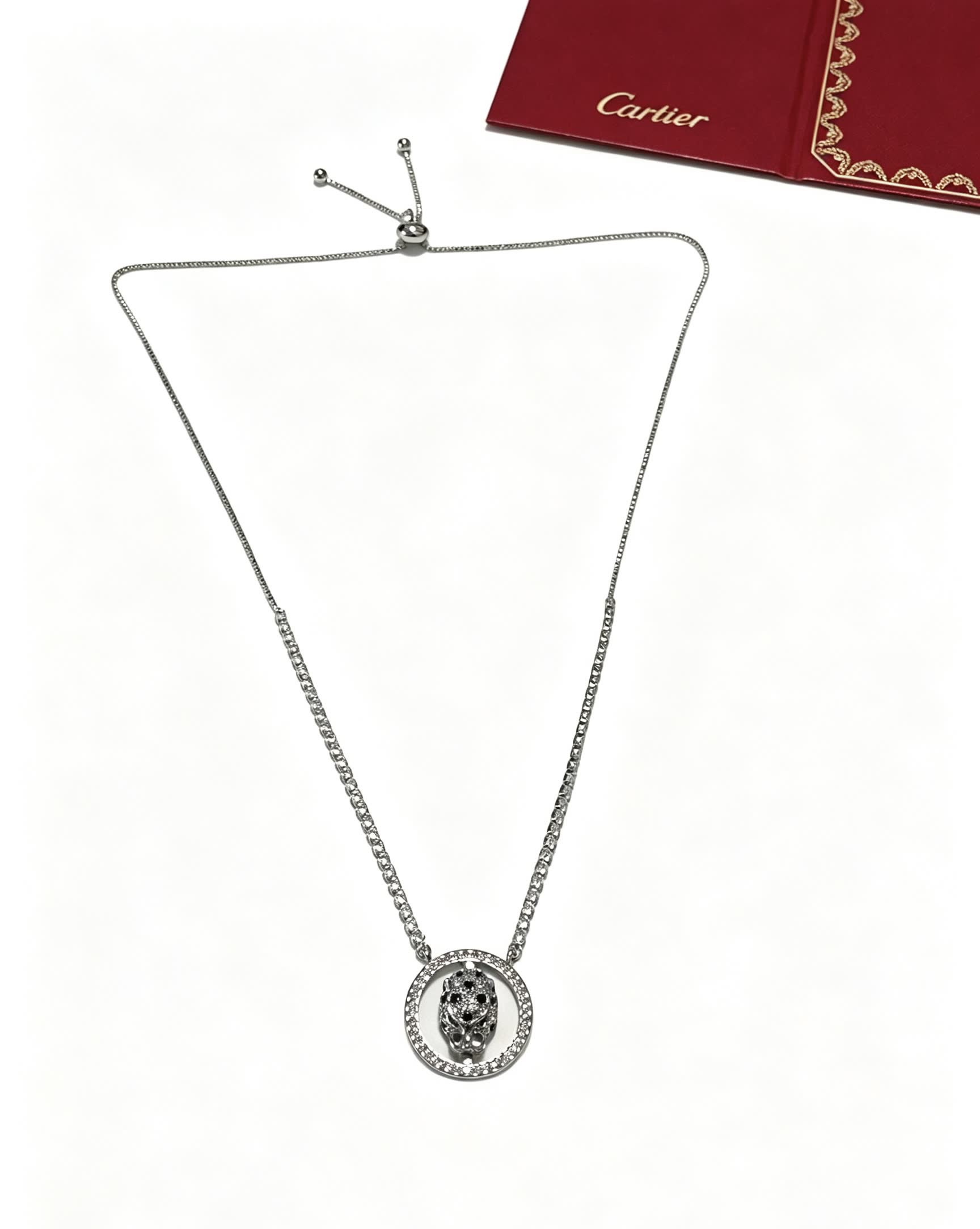Cartier Silver Circle Pendant with Black Stones