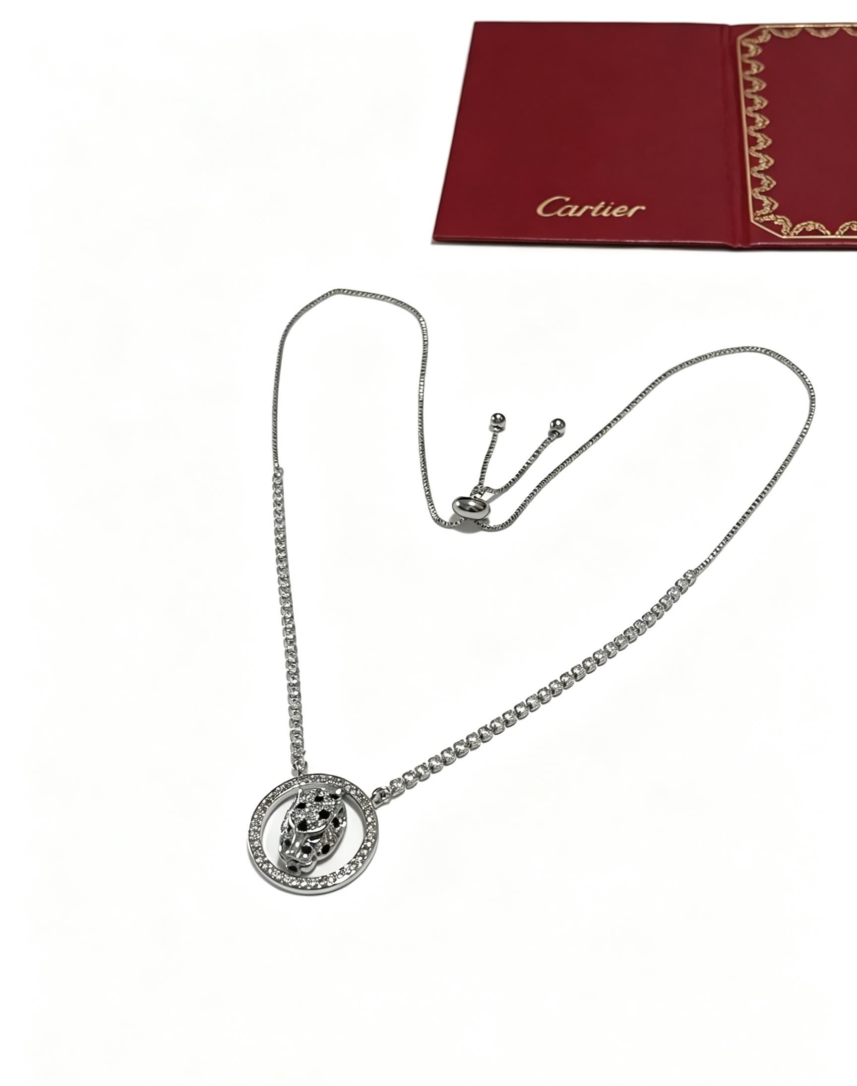 Cartier Silver Circle Pendant with Black Stones