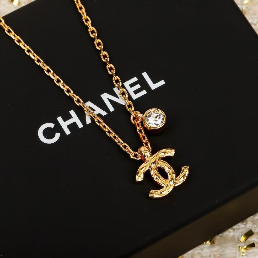 Chanel CC Logo Gold Tone Necklace with Crystal Charm