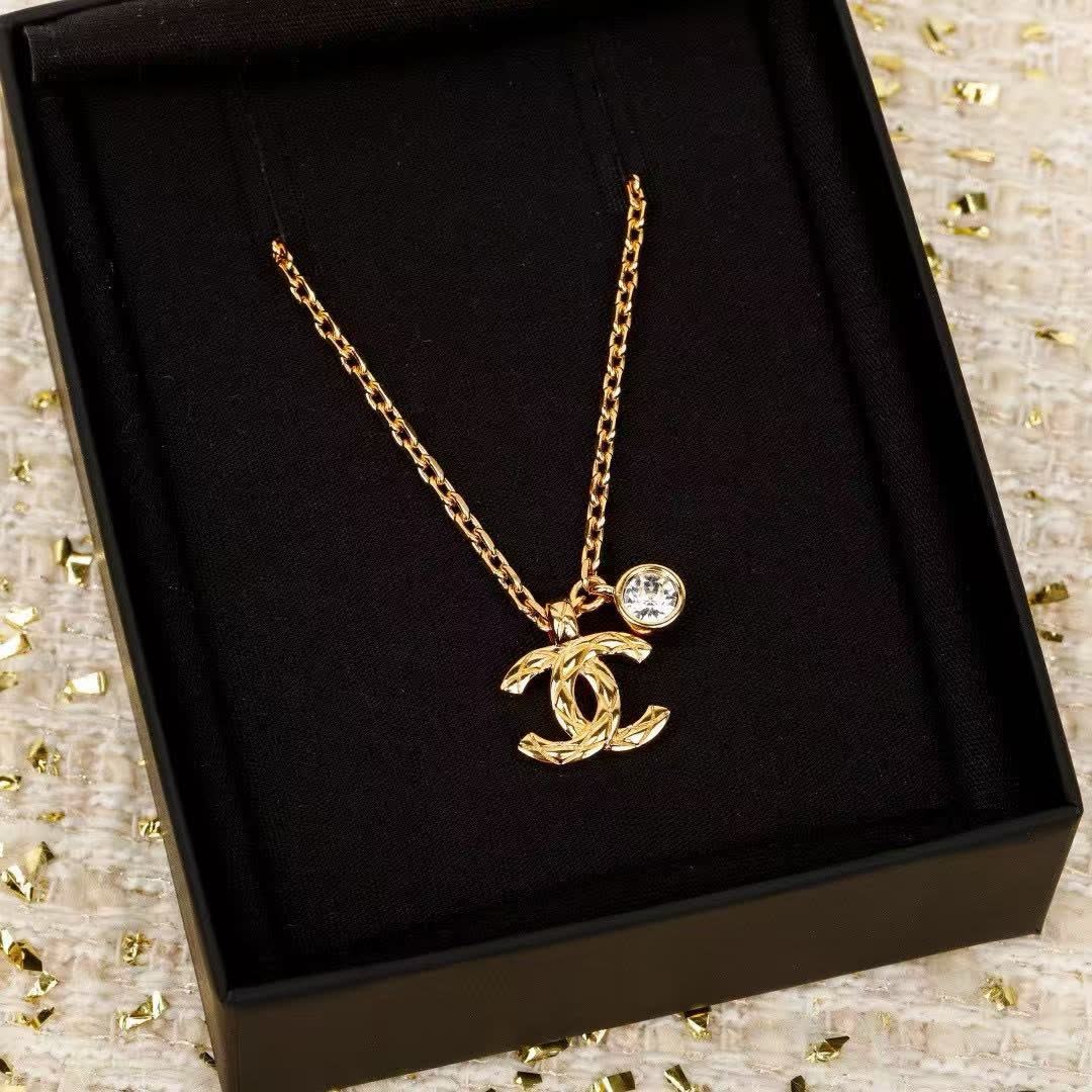Chanel CC Logo Gold Tone Necklace with Crystal Charm