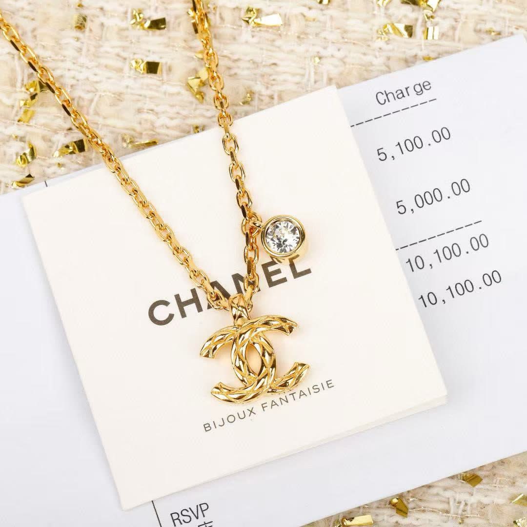 Chanel CC Logo Gold Tone Necklace with Crystal Charm