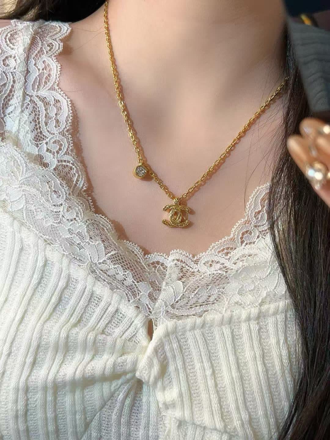 Chanel CC Logo Gold Tone Necklace with Crystal Charm