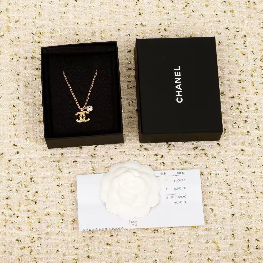 Chanel CC Logo Gold Tone Necklace with Crystal Charm
