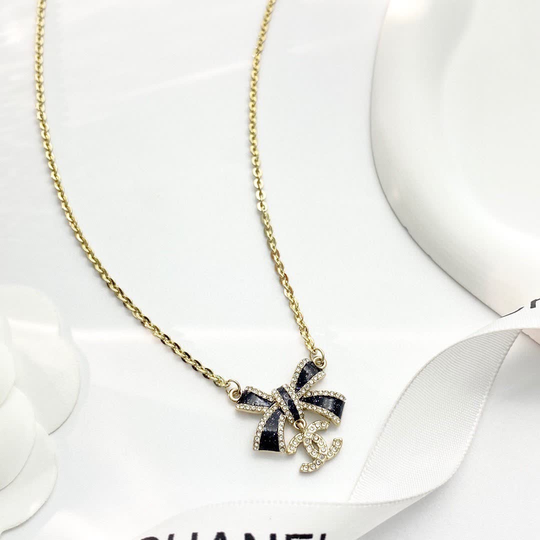 Chanel Gold Tone Black Bow Necklace