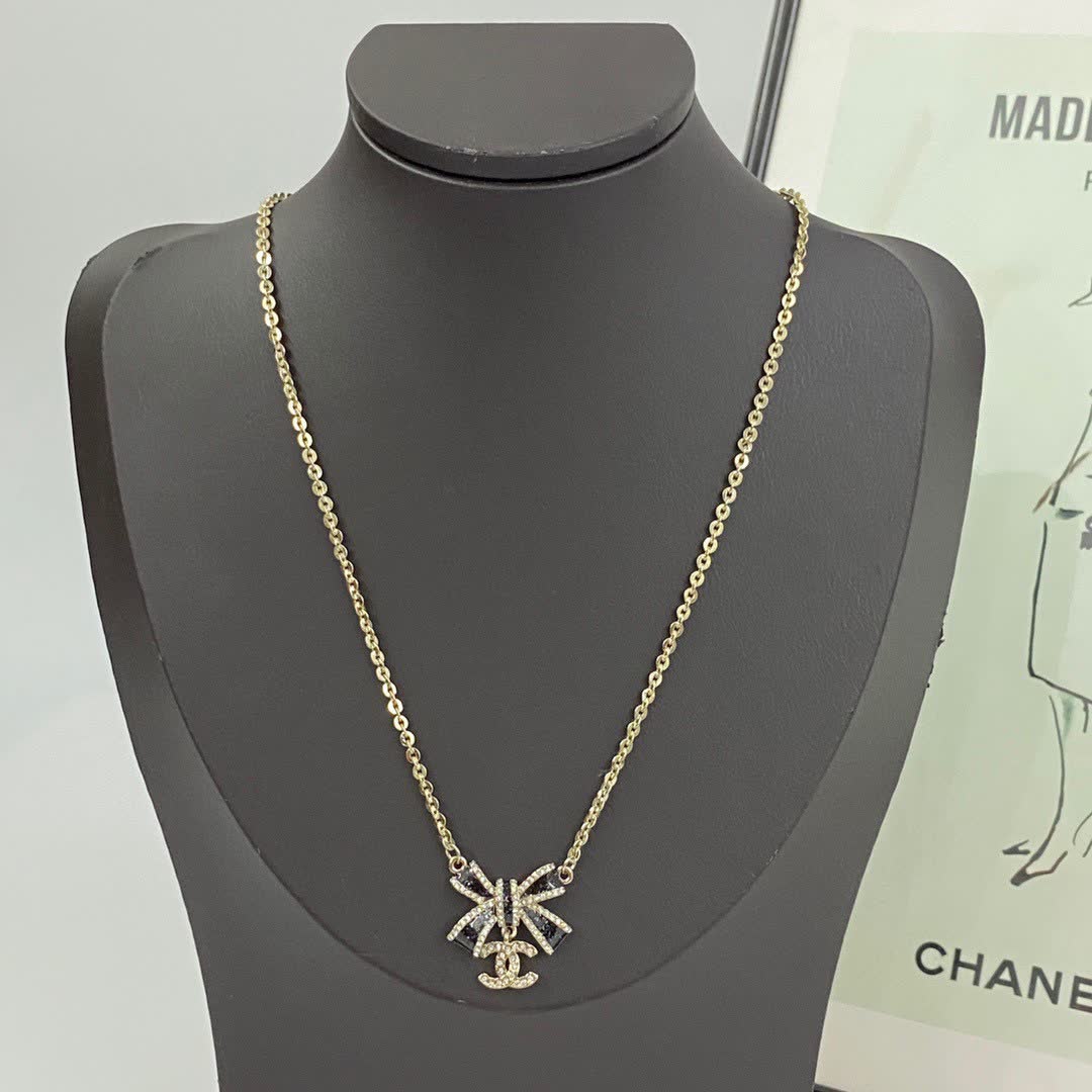 Chanel Gold Tone Black Bow Necklace