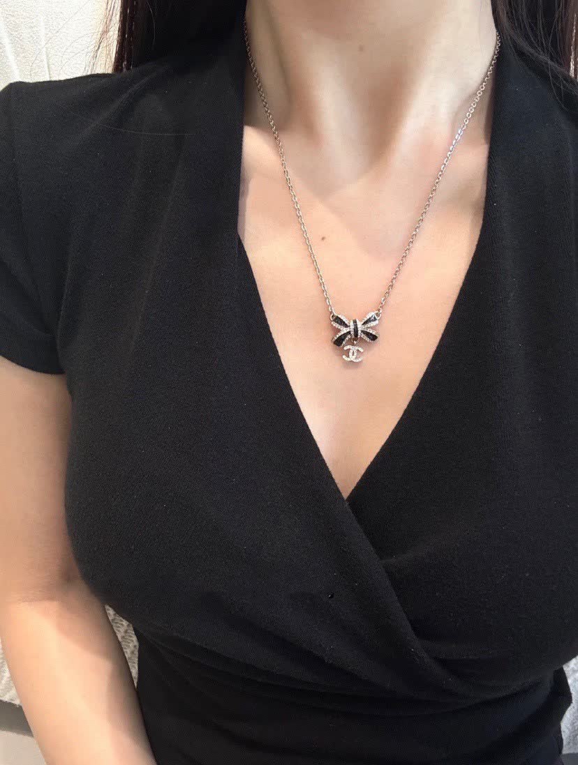 Chanel Gold Tone Black Bow Necklace
