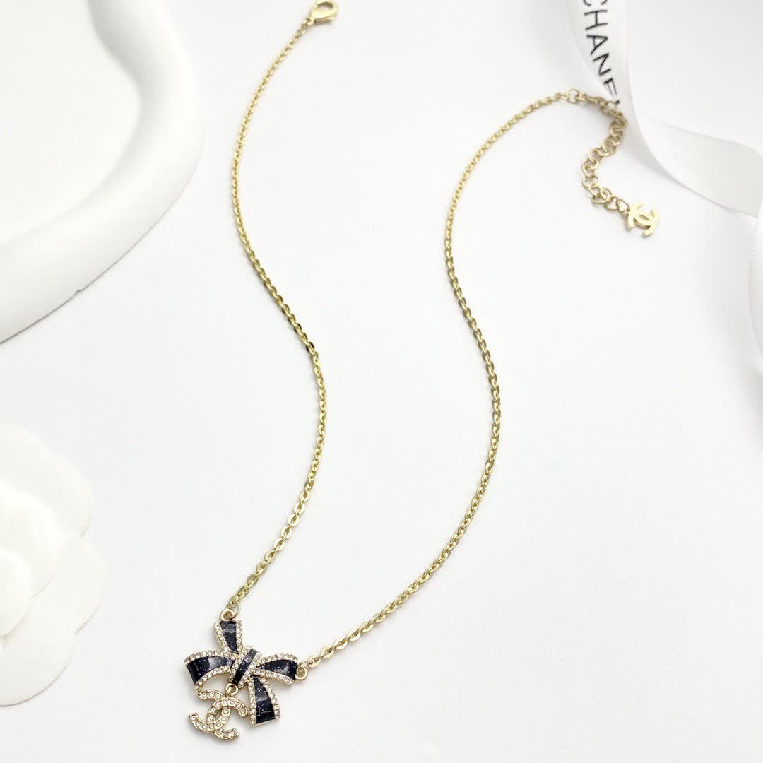 Chanel Gold Tone Black Bow Necklace