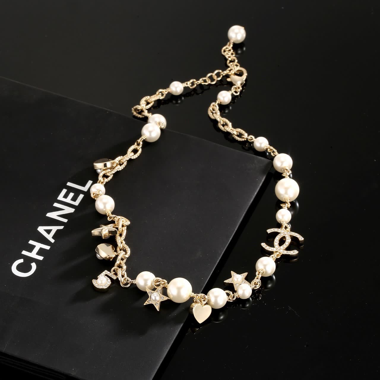 Chanel Pearl and Charm Necklace