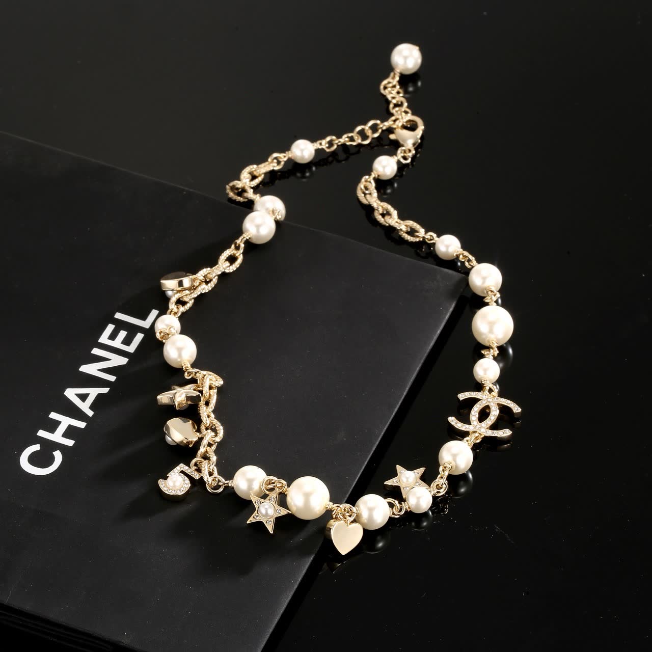 Chanel Pearl and Charm Necklace